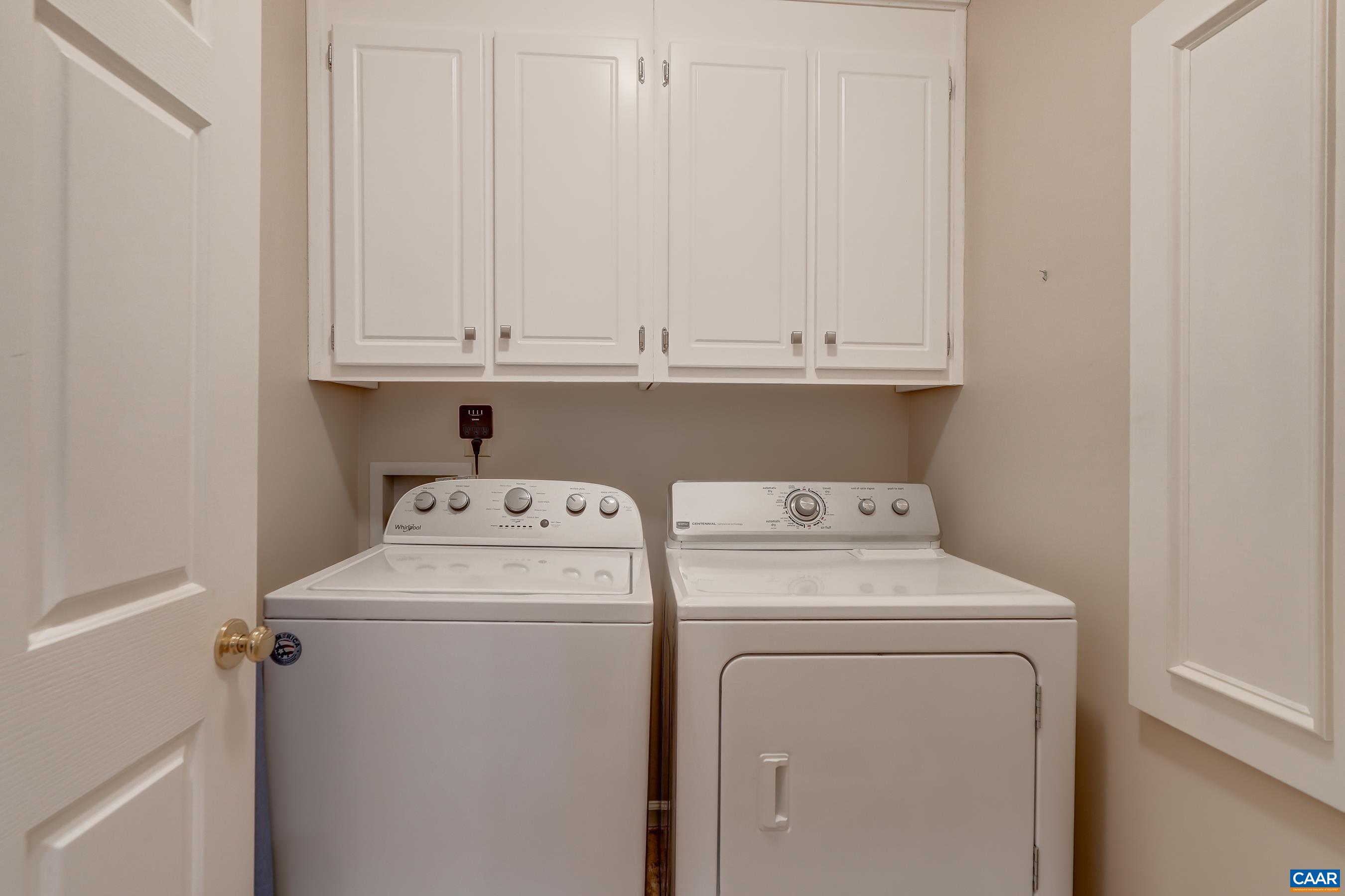 Main level laundry room (with a laundry chute from primary bedroom!) Main level laundry room (with a laundry chute from primary bedroom!)