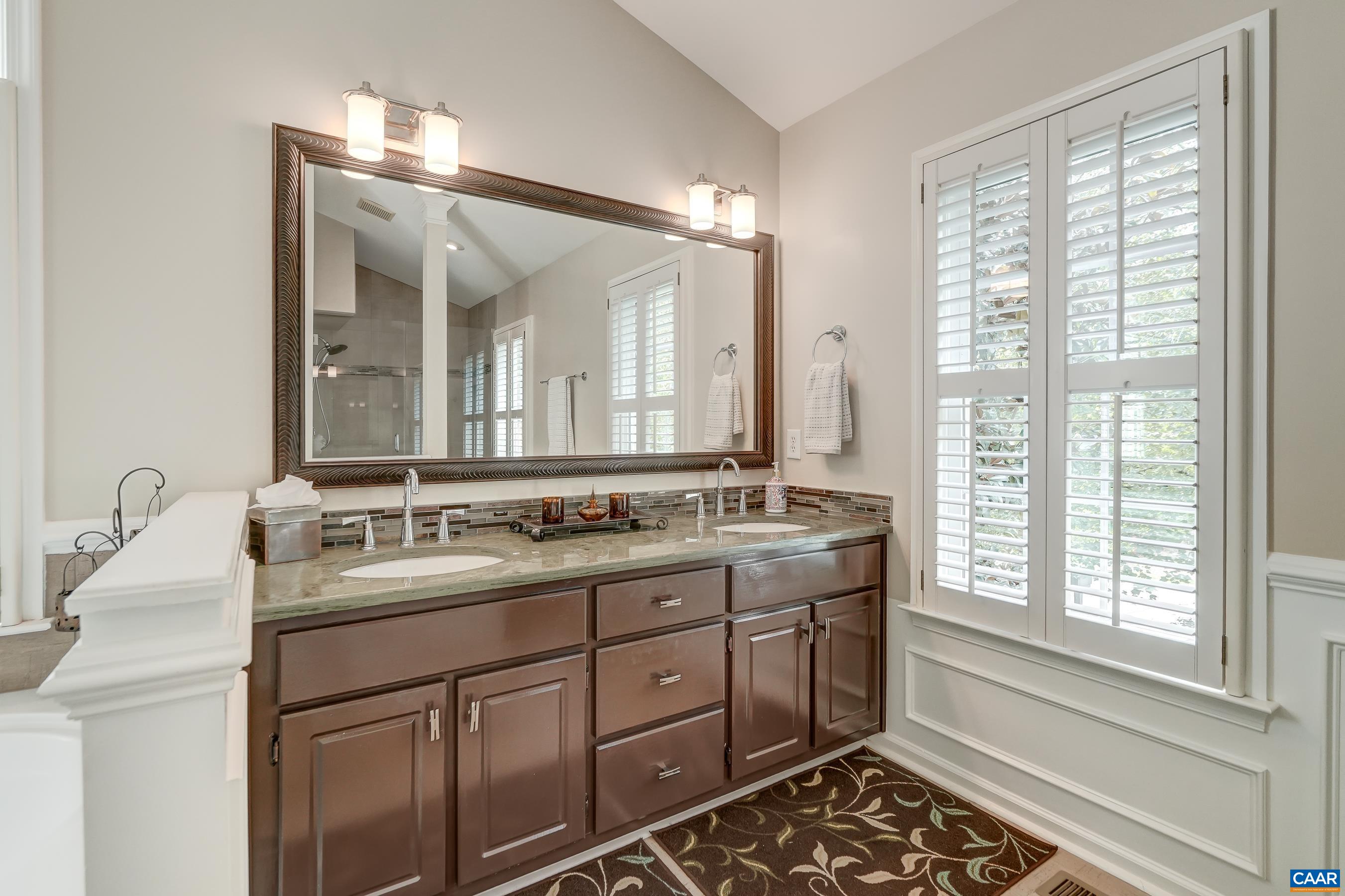 Primary bathroom with dual sink vanity. Primary bathroom with dual sink vanity.