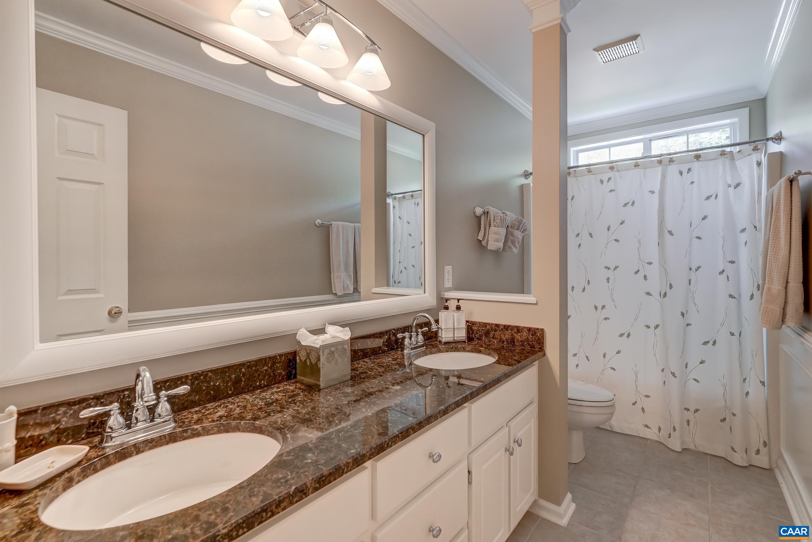 Full hall bath with dual sink vanity. Full hall bath with dual sink vanity.
