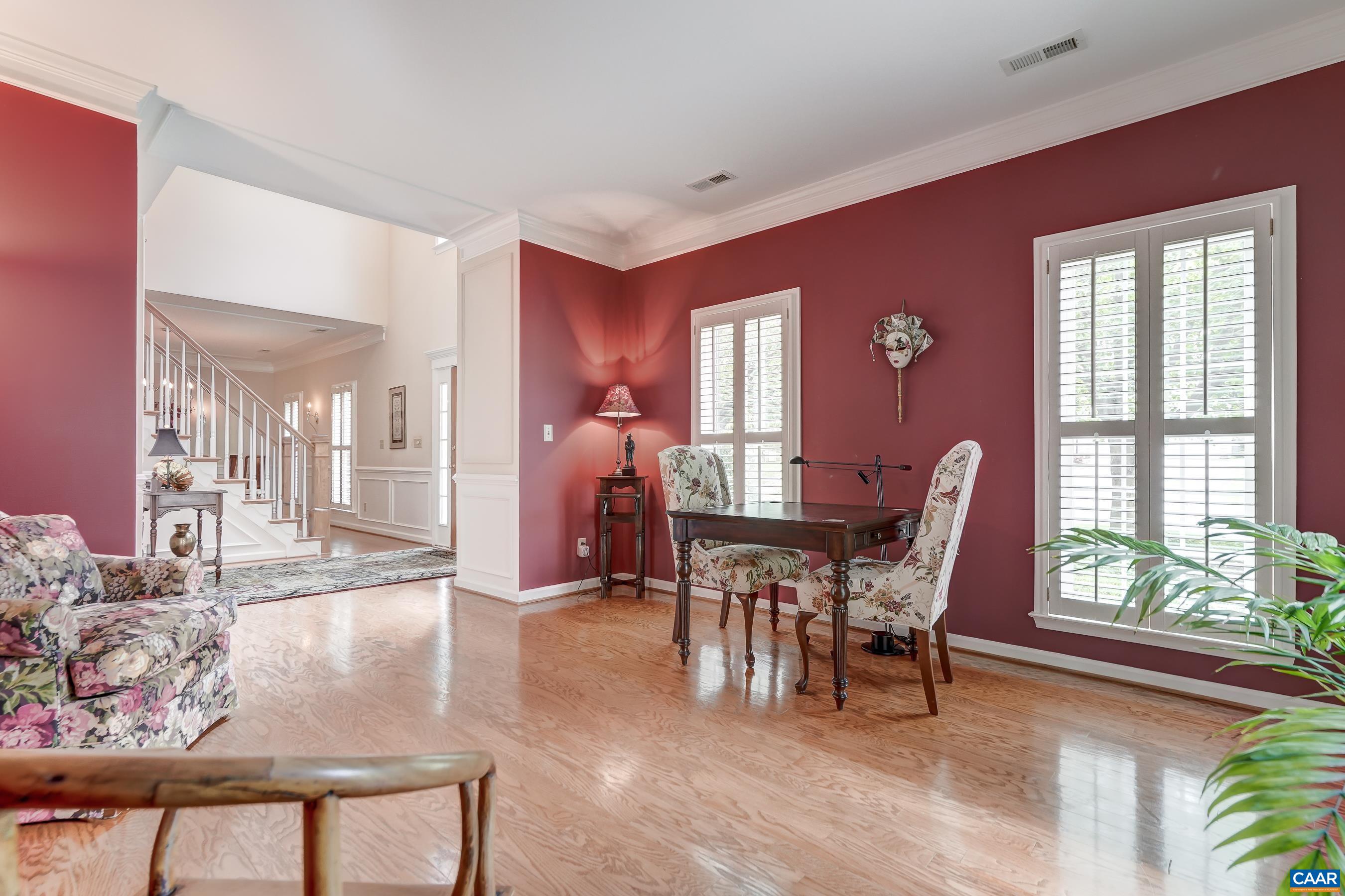 Formal living room/game room with built-in shelves could also be a private home office. Formal living room/game room with built-in shelves could also be a private home office.