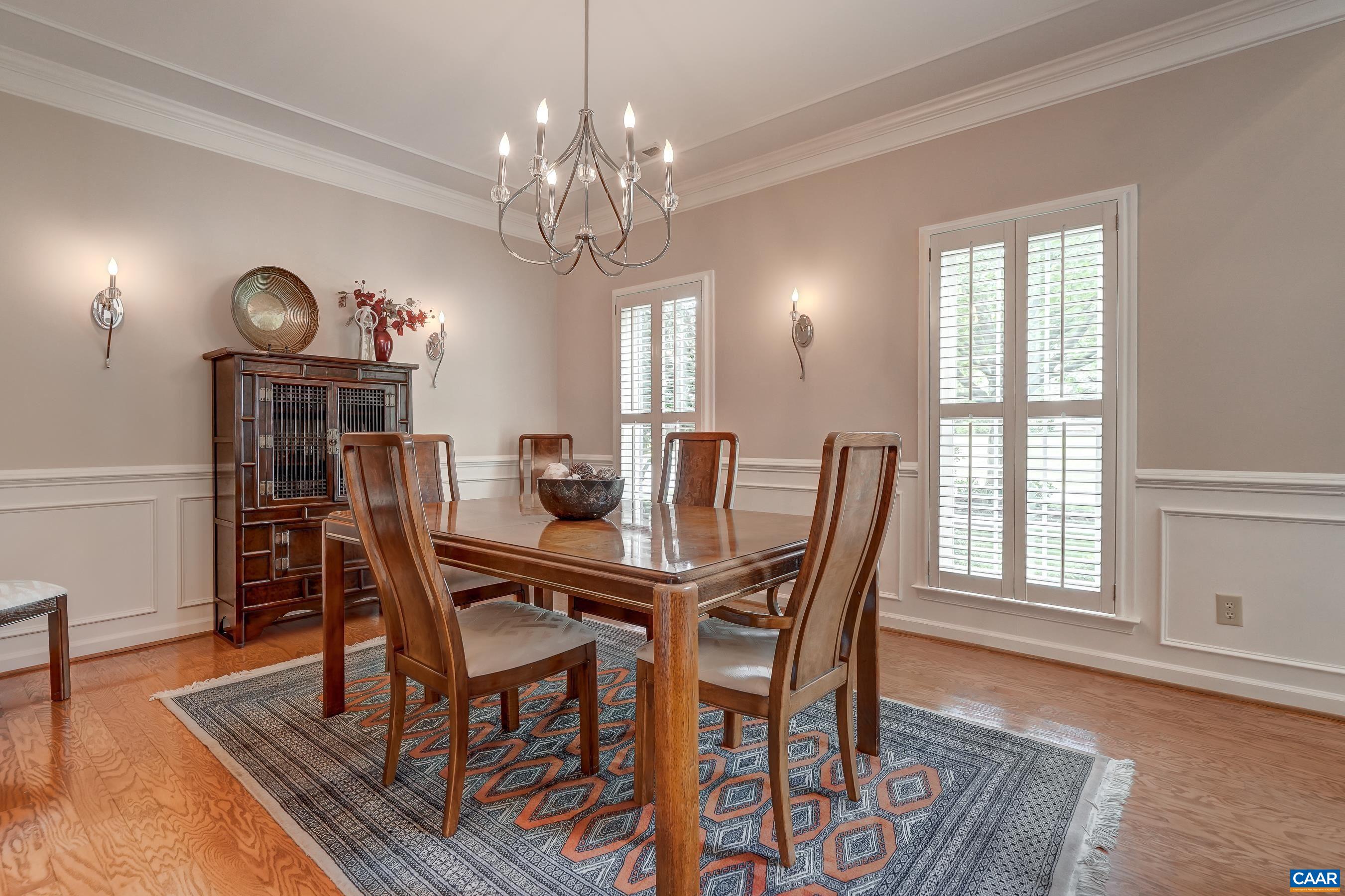 Formal dining room with updated chandelier. Formal dining room with updated chandelier.