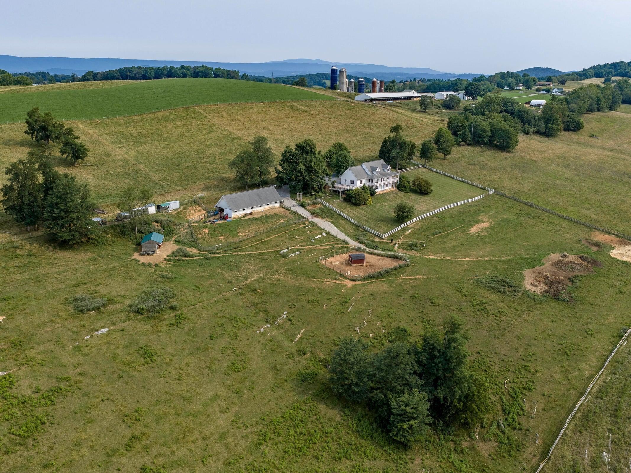 Currently home to Gentle Acres Animal Haven, the property is equipped for livestock and hobby farming with a four-stall barn featuring water and electricity, a dedicated cow run-in, pig shelter, multiple poultry coops with covered enclosures, electric fen Currently home to Gentle Acres Animal Haven, the property is equipped for livestock and hobby farming with a four-stall barn featuring water and electricity, a dedicated cow run-in, pig shelter, multiple poultry coops with covered enclosures, electric fen