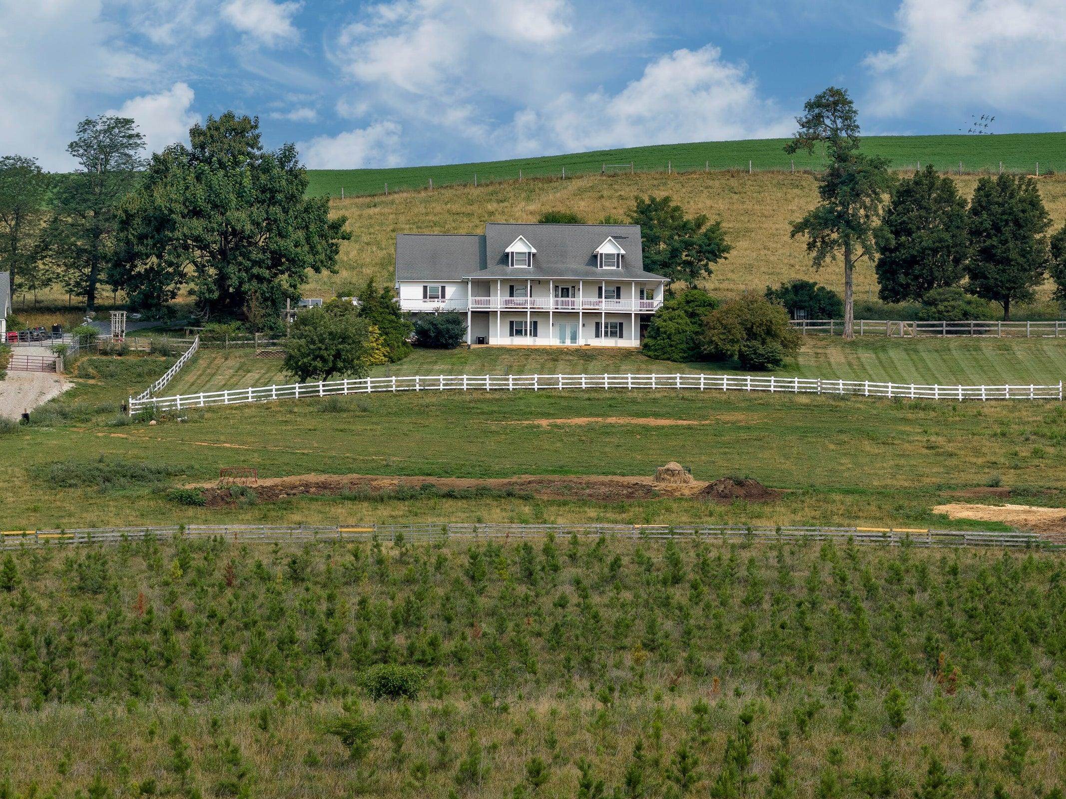 Soak in the fresh air and take in the ever-changing Blue Ridge views from the expansive wrap-around porches. Soak in the fresh air and take in the ever-changing Blue Ridge views from the expansive wrap-around porches.