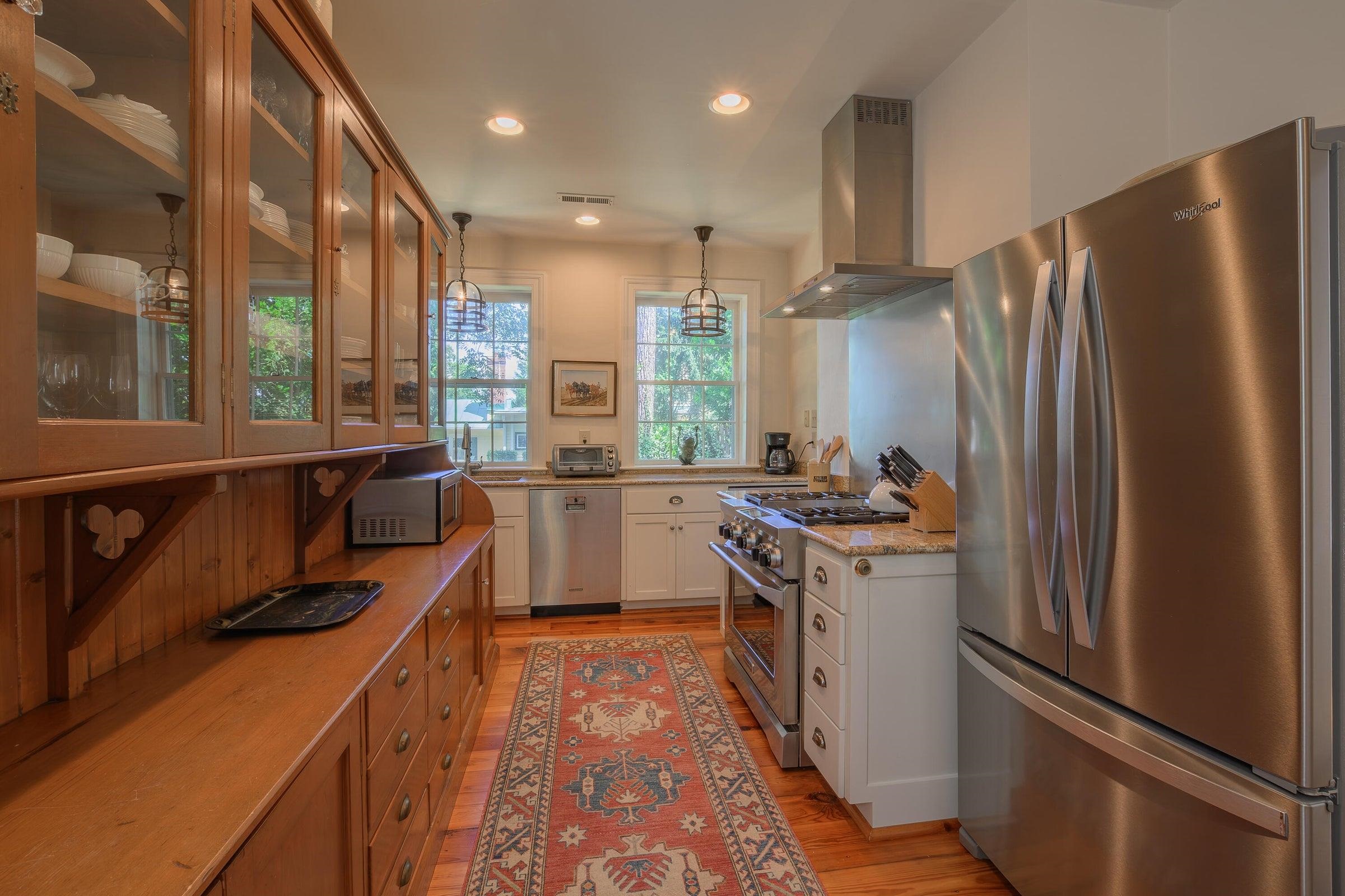 The modern kitchen pairs historic character with contemporary convenience. The modern kitchen pairs historic character with contemporary convenience.