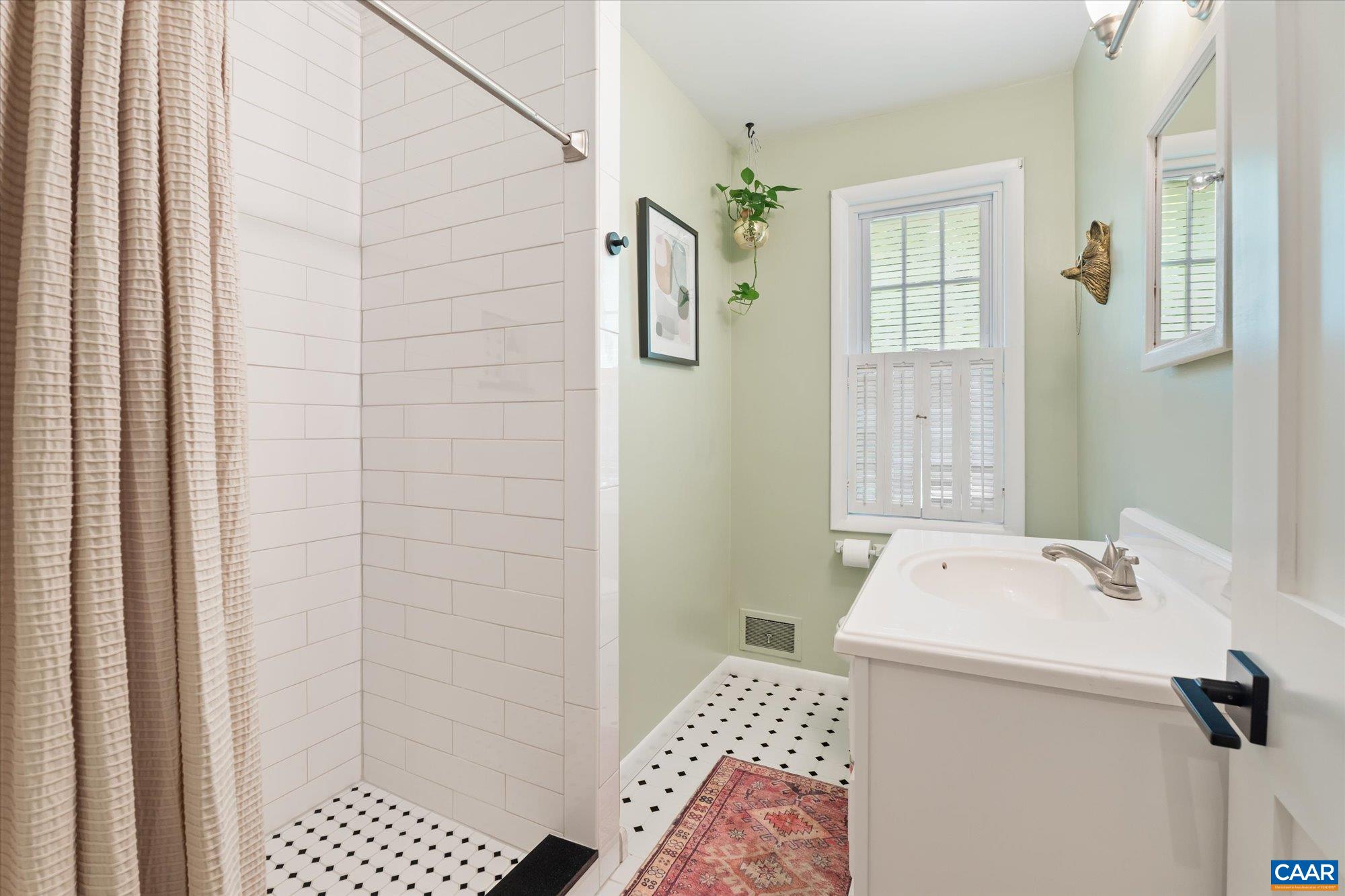 Updated finishes w/ tile shower stall & floor. Nice for guests & serves the other 2 bedrooms. Updated finishes w/ tile shower stall & floor. Nice for guests & serves the other 2 bedrooms.