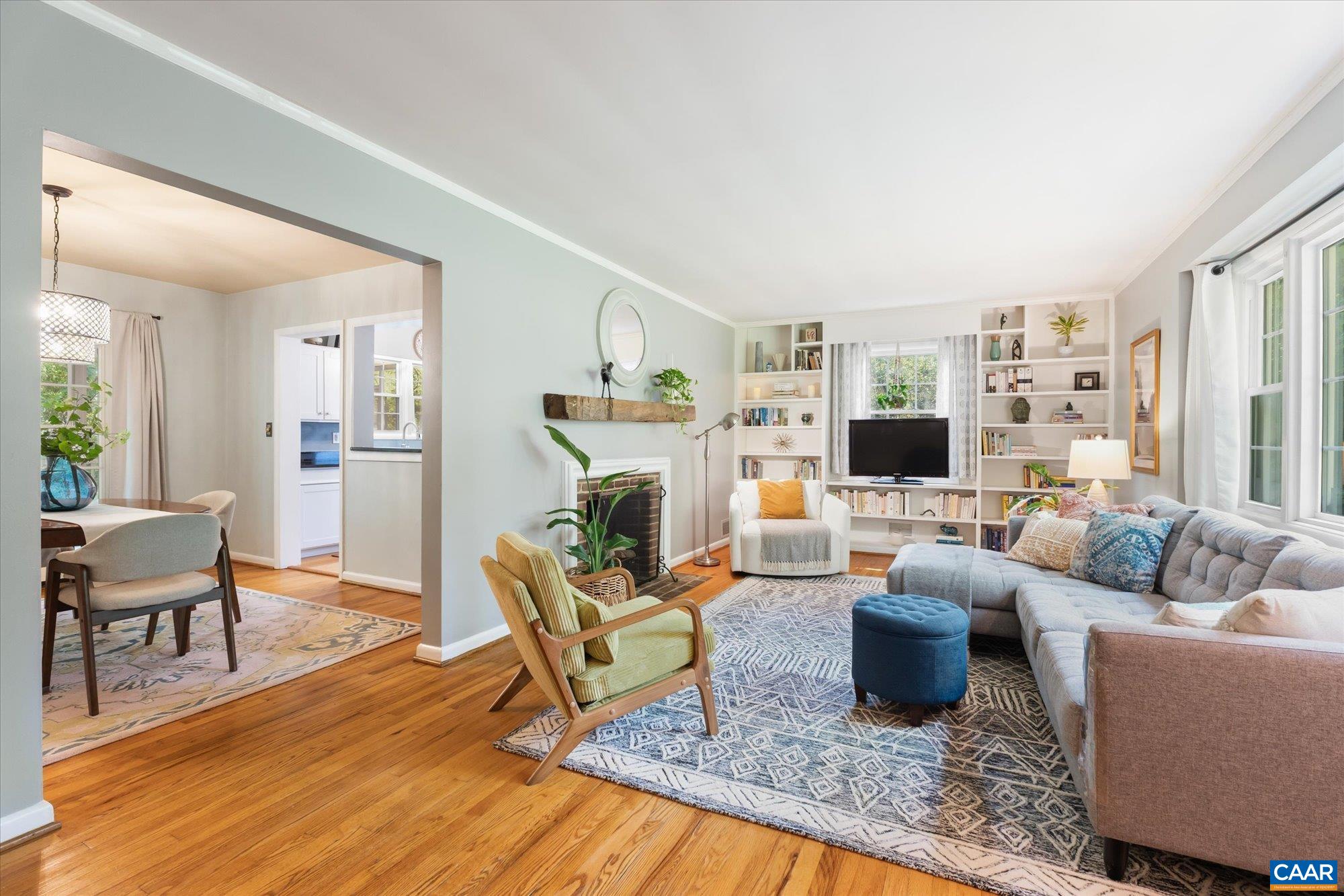 Open to the diningroom & features a large picture window, built-in book cases, a wood burning fireplace and gorgeous oak floors. Open to the diningroom & features a large picture window, built-in book cases, a wood burning fireplace and gorgeous oak floors.