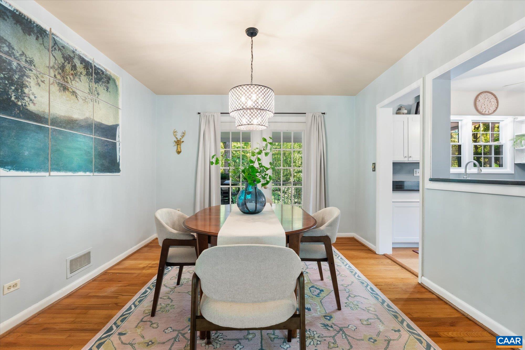 A cozy space opens to the kitchen and back screened porch is great for both quiet dinners and entertaining! A cozy space opens to the kitchen and back screened porch is great for both quiet dinners and entertaining!