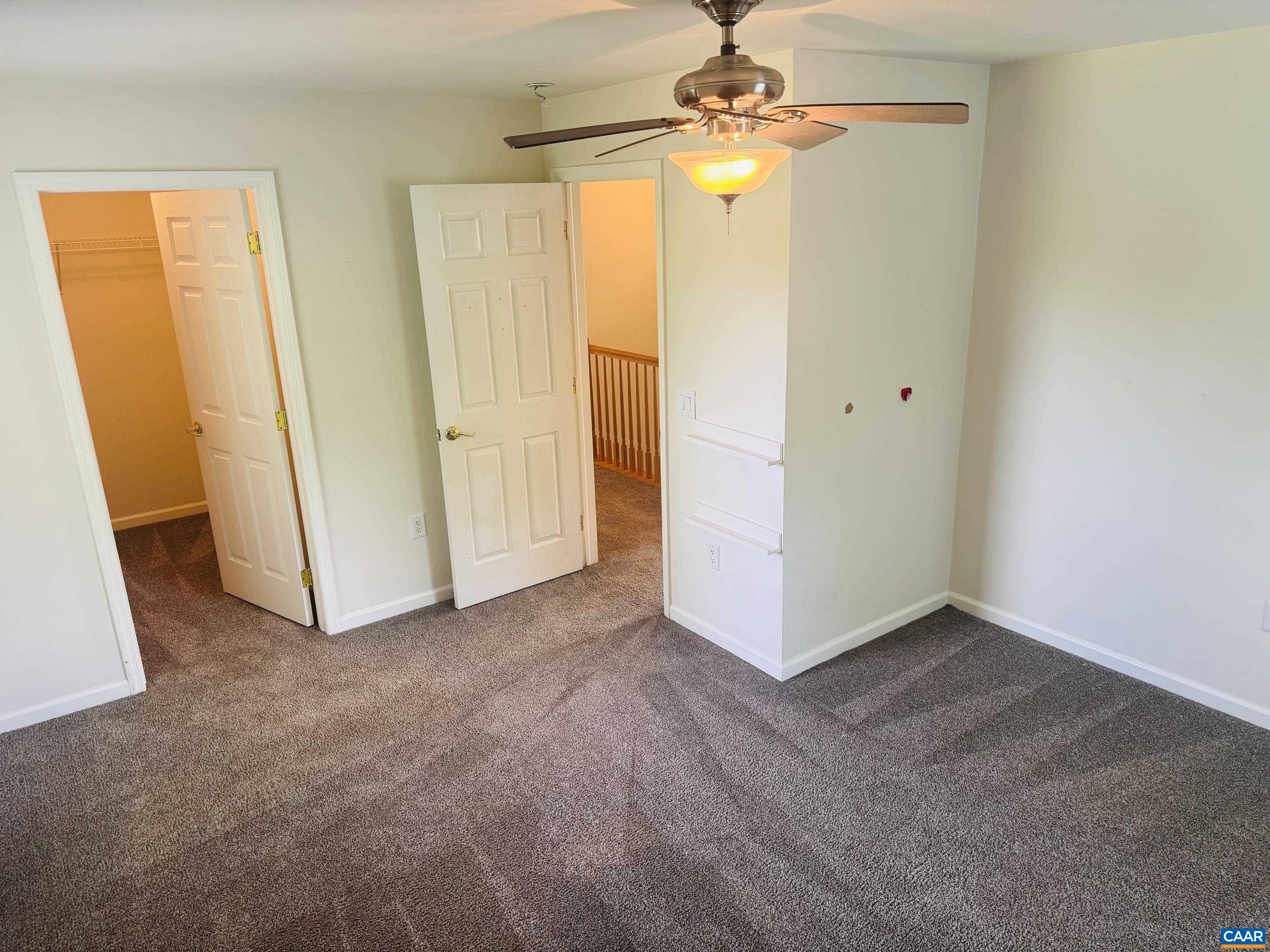 with walk-in closet with walk-in closet