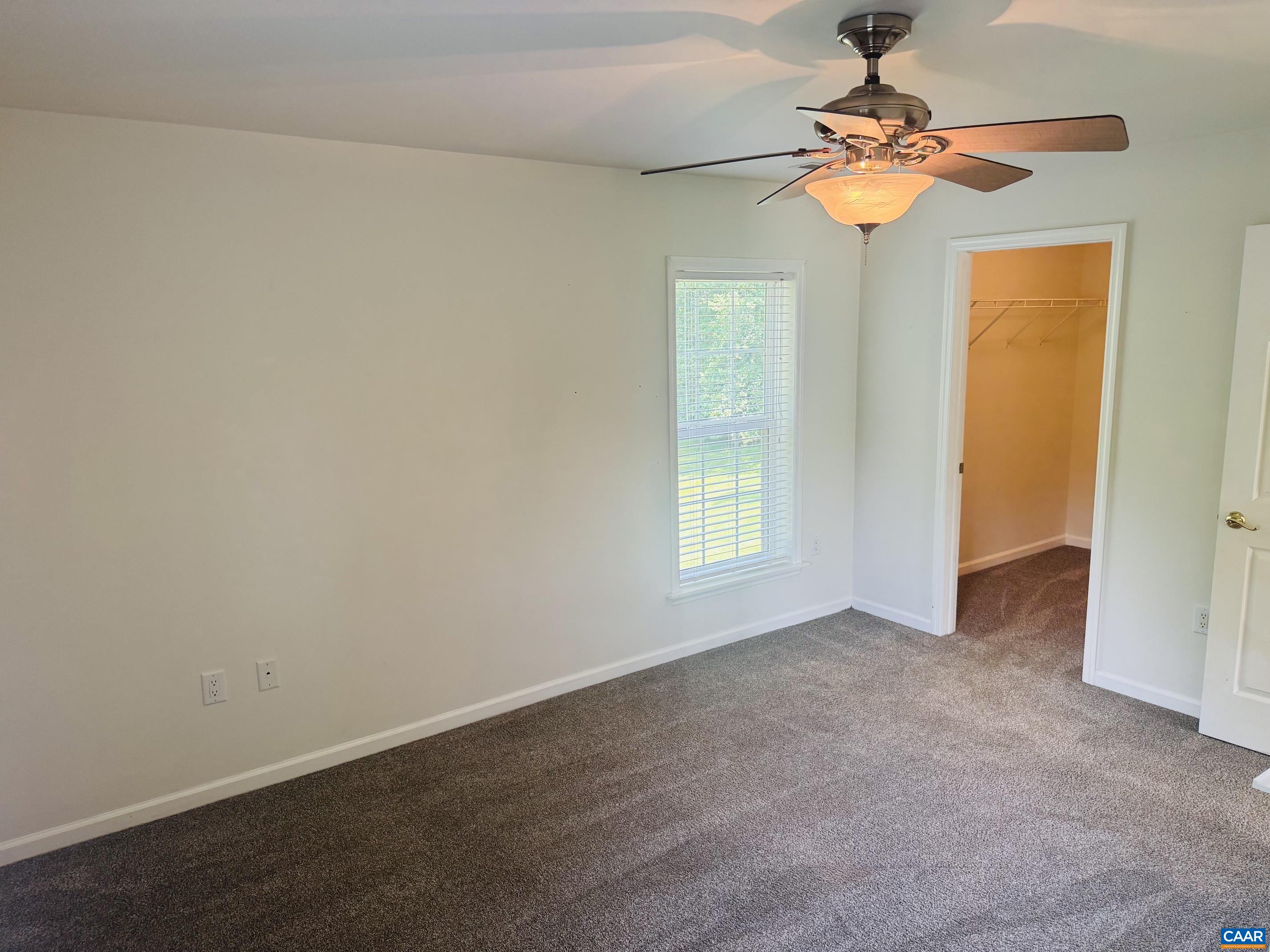 with walk-in closet with walk-in closet