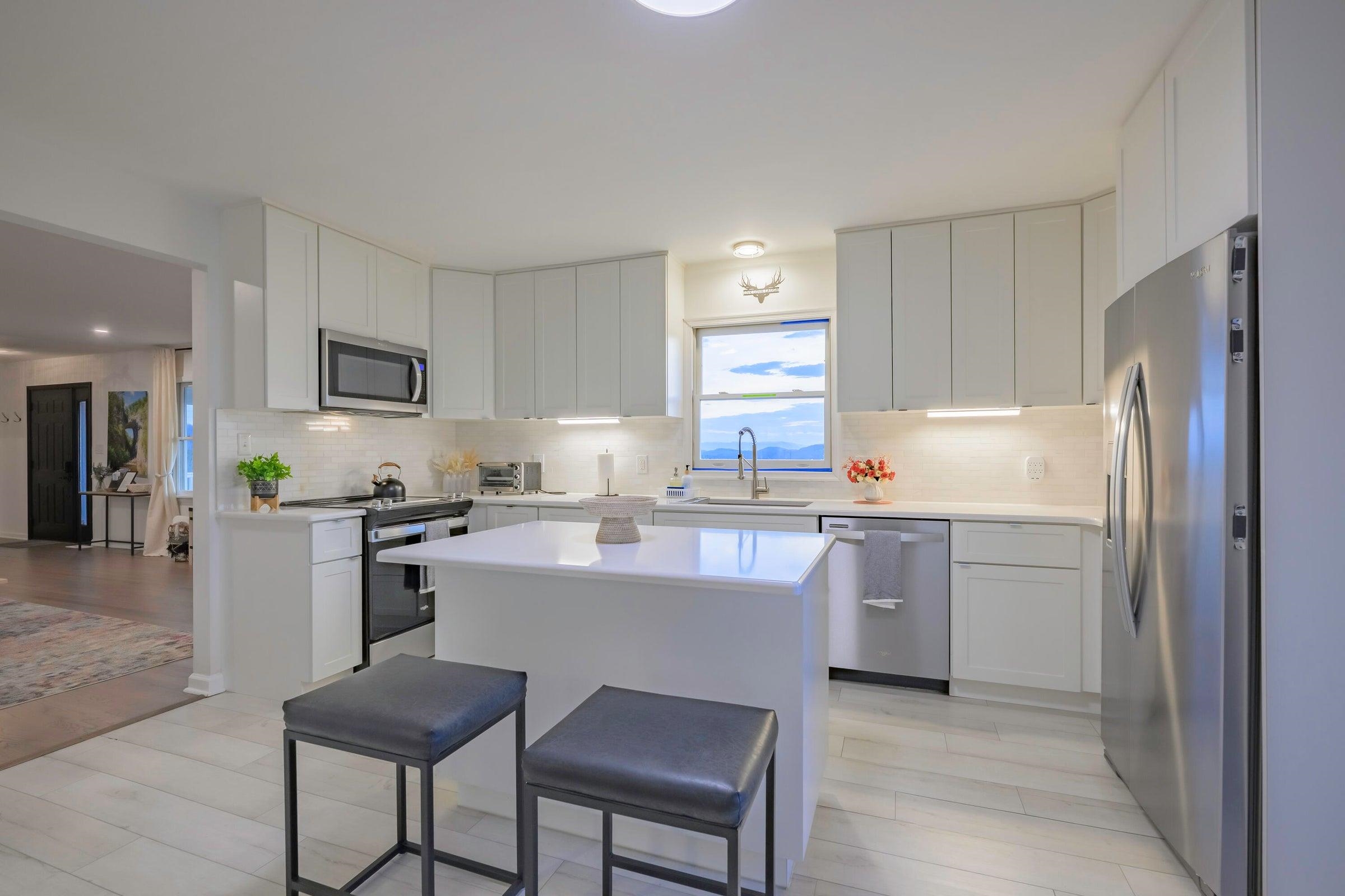 New Laminated floors make kitchen clean up easy.