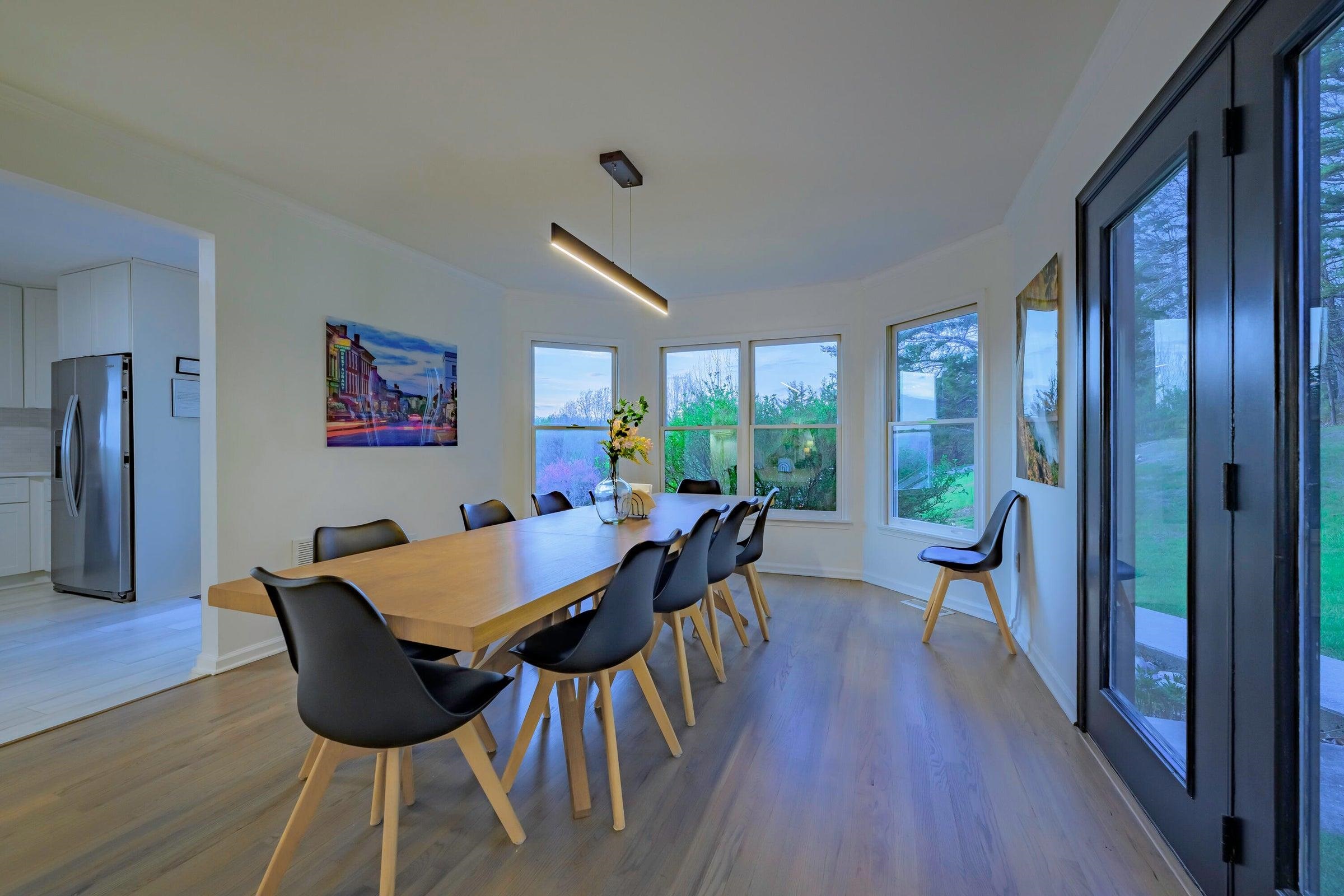 The kitchen opens to the dining room. Notice the unusual light fixture.