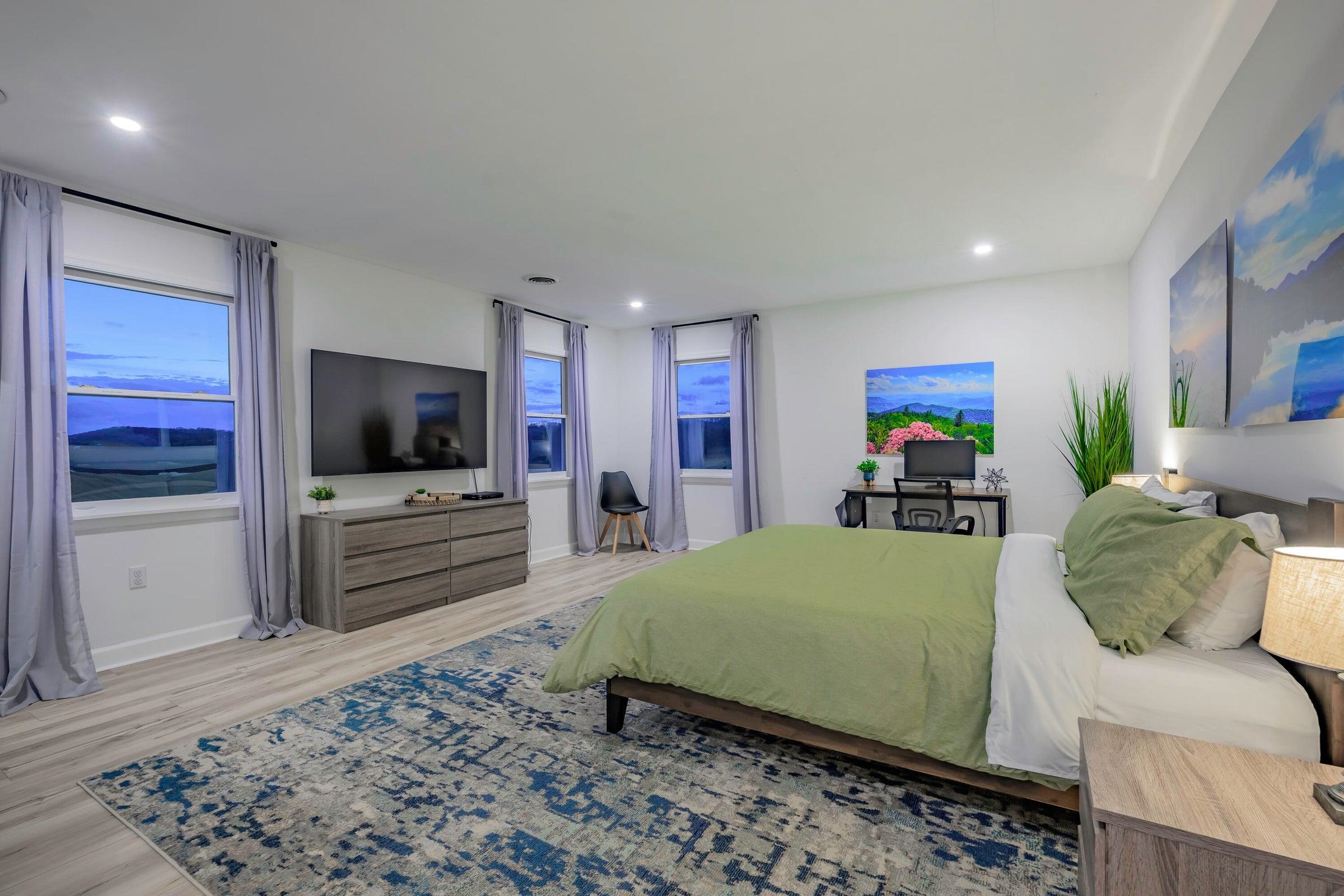 TV in the bedroom. Windows to watch the sunset and moon rise.