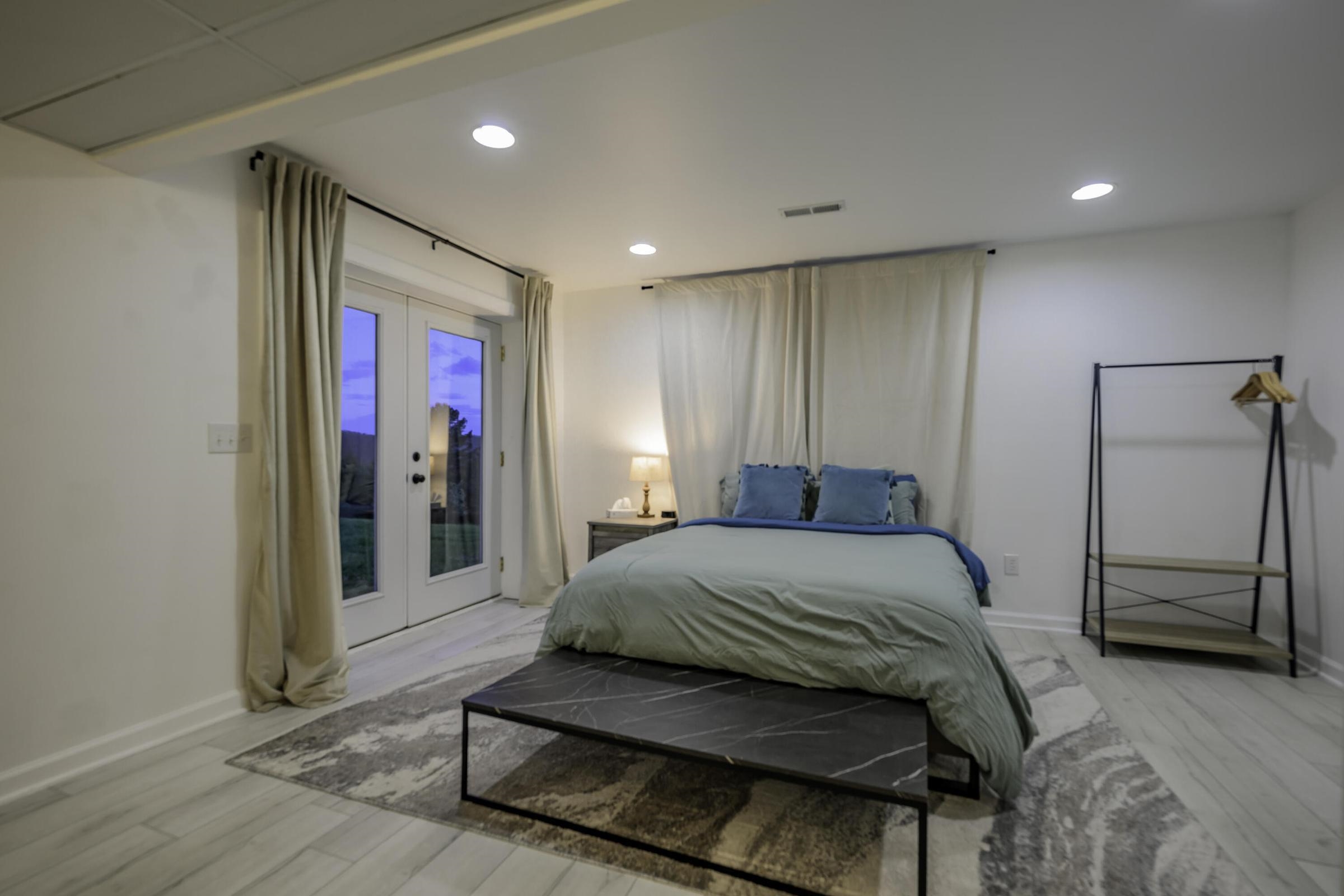 Double doors from this bedroom lead to outside.