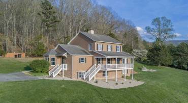 Tucked into the side of the impressive Blue Ridge Mountains is 377 Rattler Rd.
