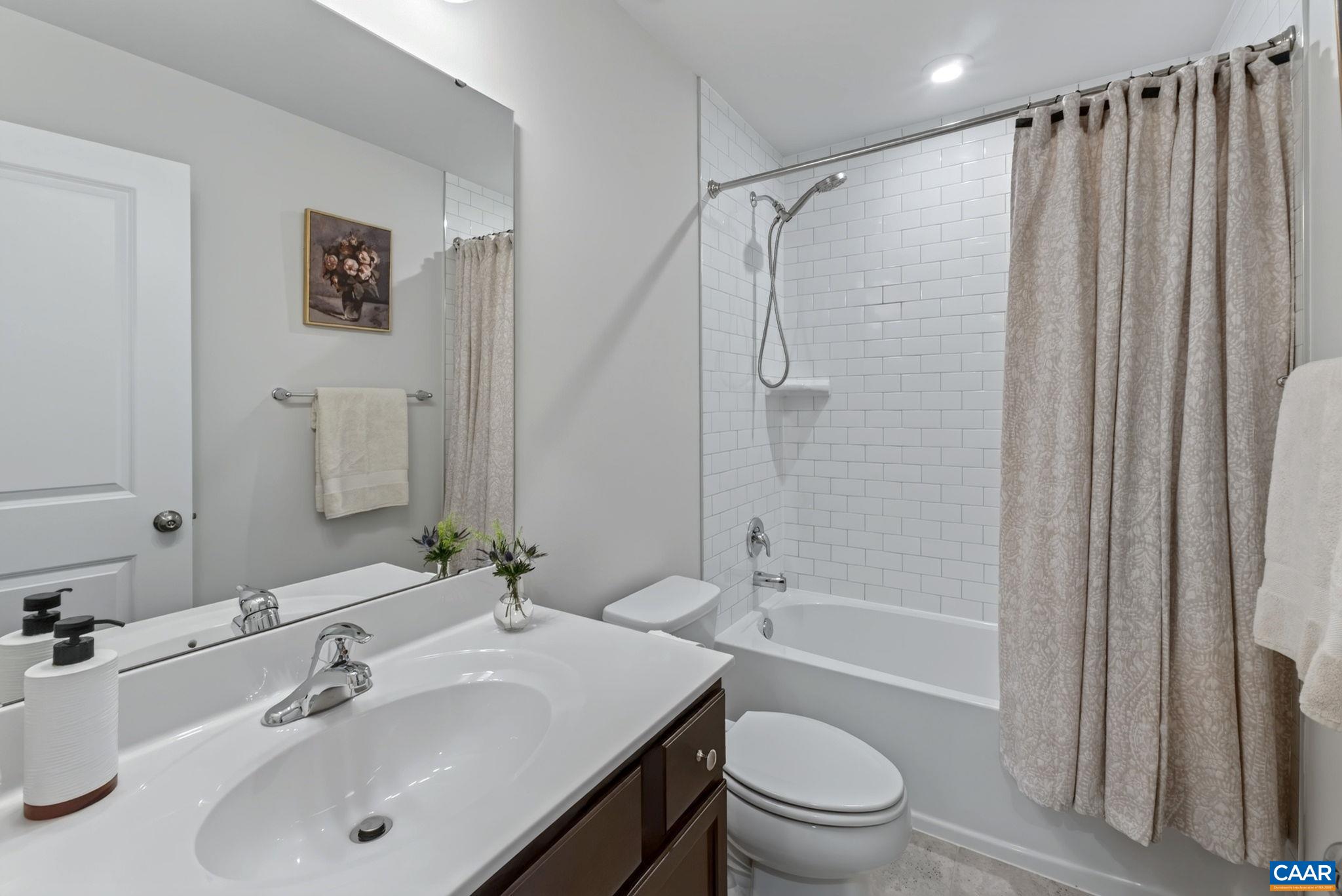 Home has a total of 3 full and 1 half baths. All showers enjoy tile to the ceiling - part of the premier finishes that make this home standout Home has a total of 3 full and 1 half baths. All showers enjoy tile to the ceiling - part of the premier finishes that make this home standout