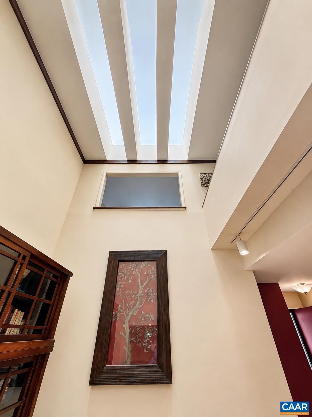 Vaulted ceiling and skylights in the dining room Vaulted ceiling and skylights in the dining room