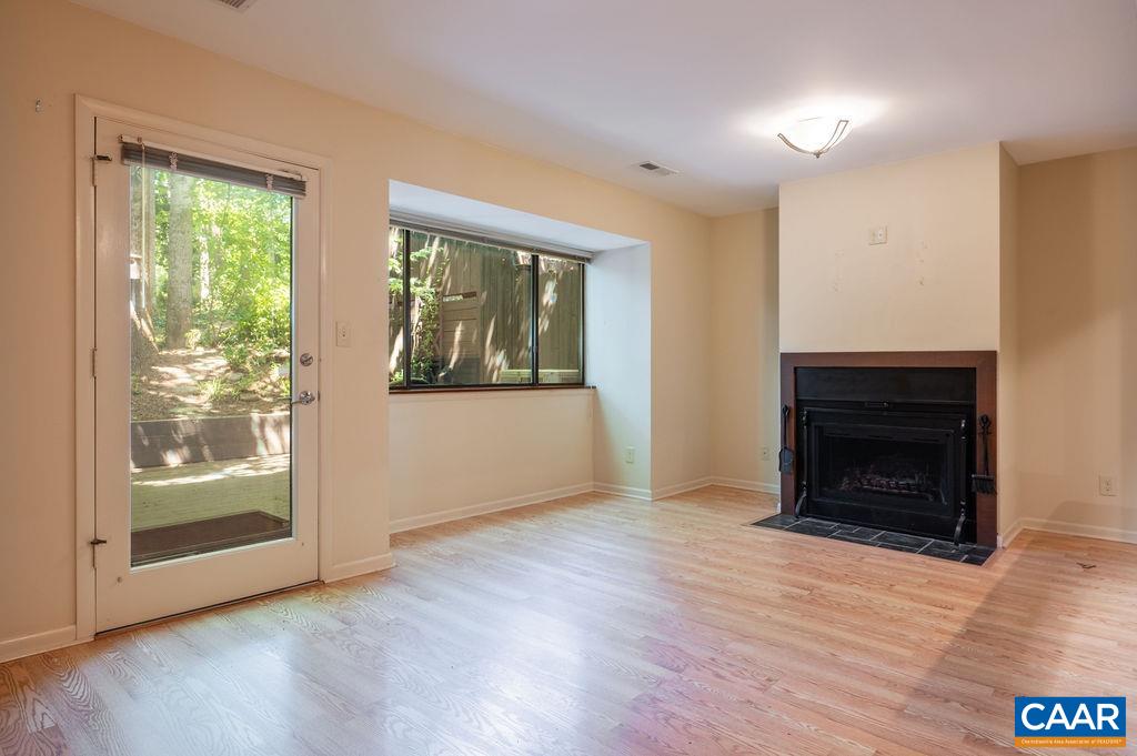 Living room has a big picture window looking into a private back yard. Living room has a big picture window looking into a private back yard.