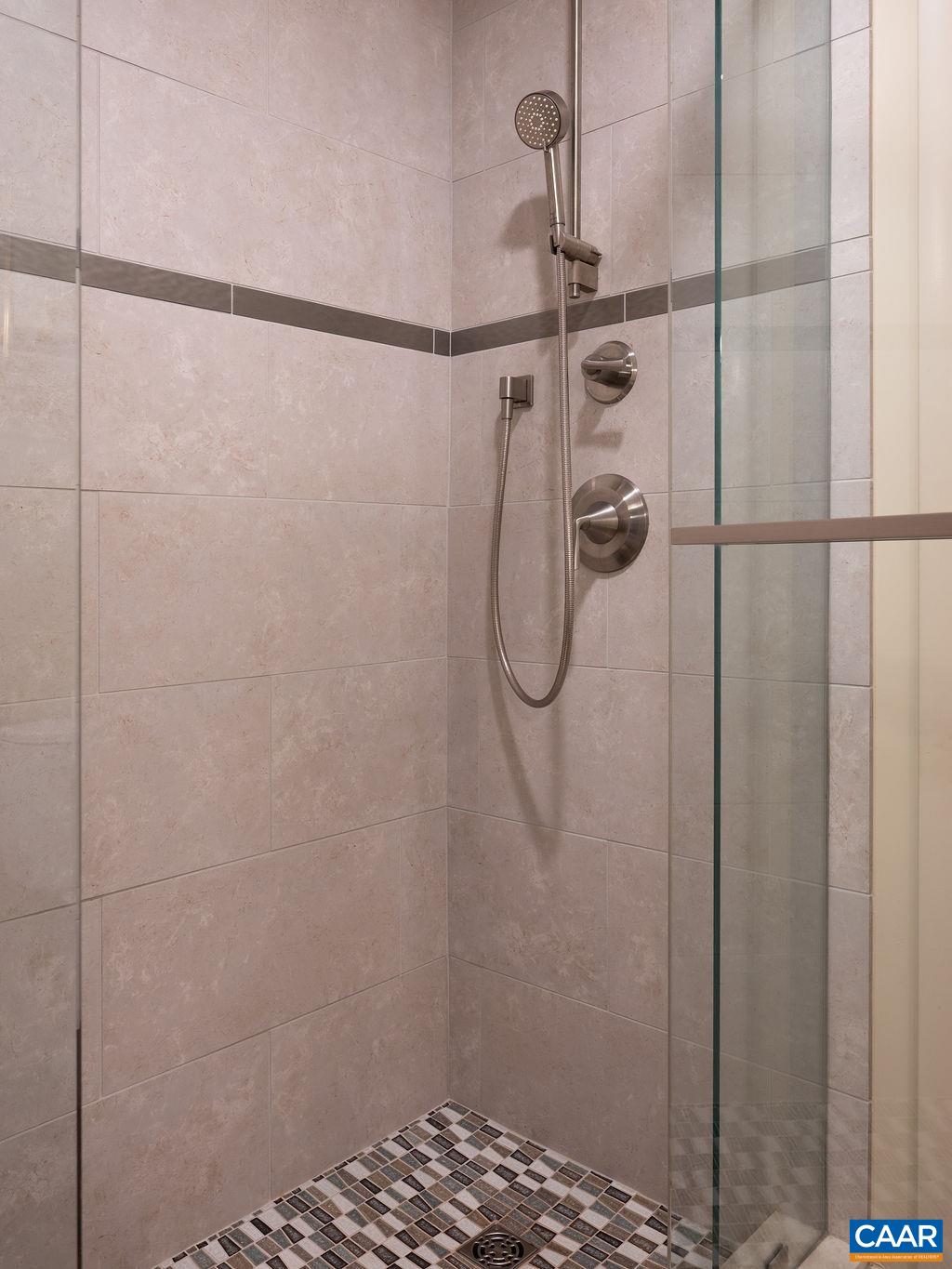 Custom tiled shower with glass doors Custom tiled shower with glass doors