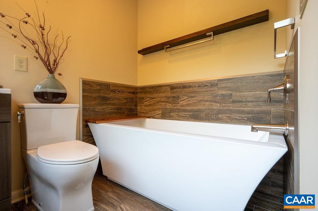 Custom vanity, tiled floor, deep soaking tub Custom vanity, tiled floor, deep soaking tub