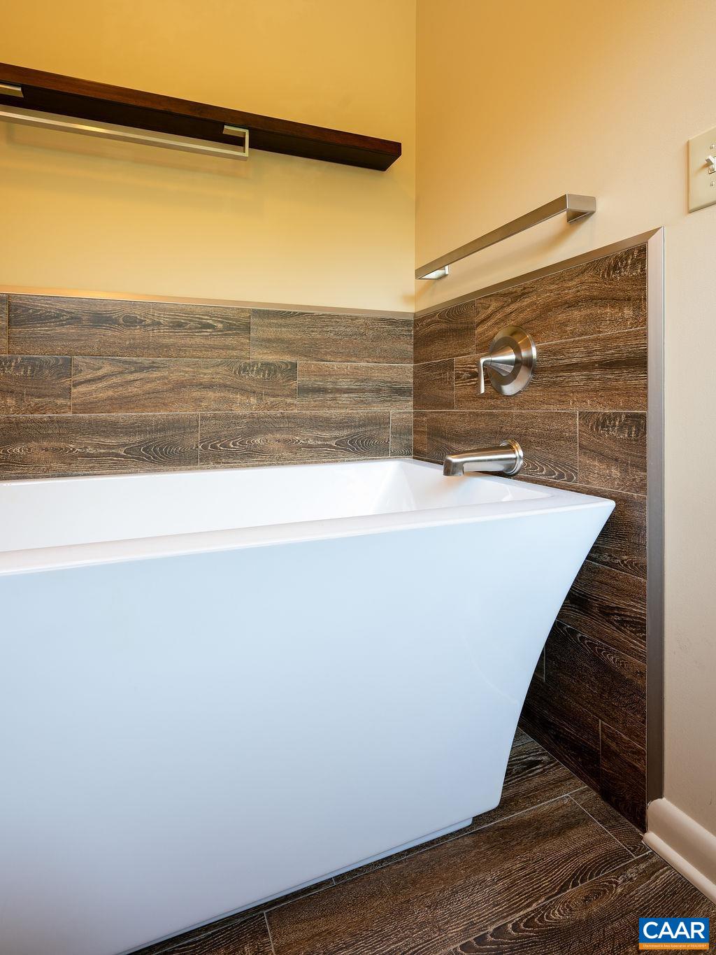 tiled backsplash behind the tub tiled backsplash behind the tub