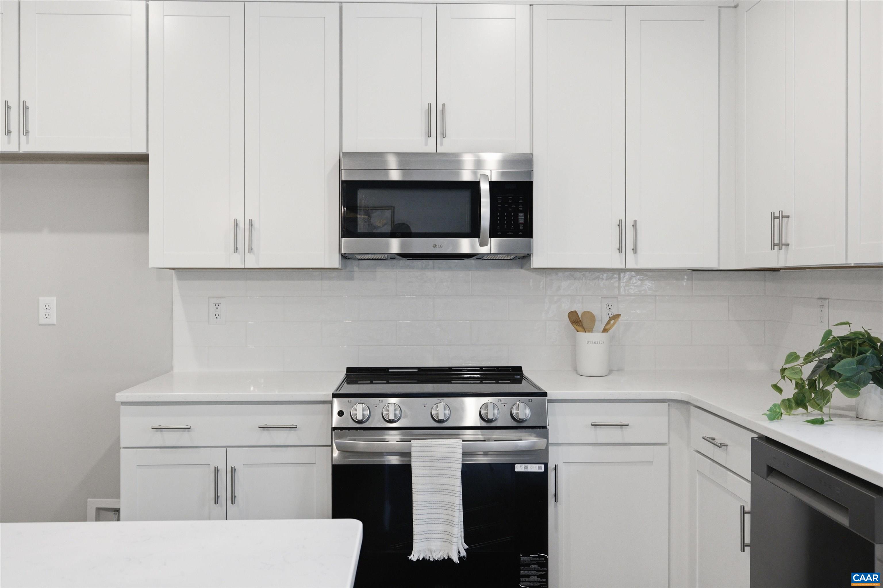 Stainless Steel Microwave, Stove and Dishwasher. Photo of for-sale home, staged.