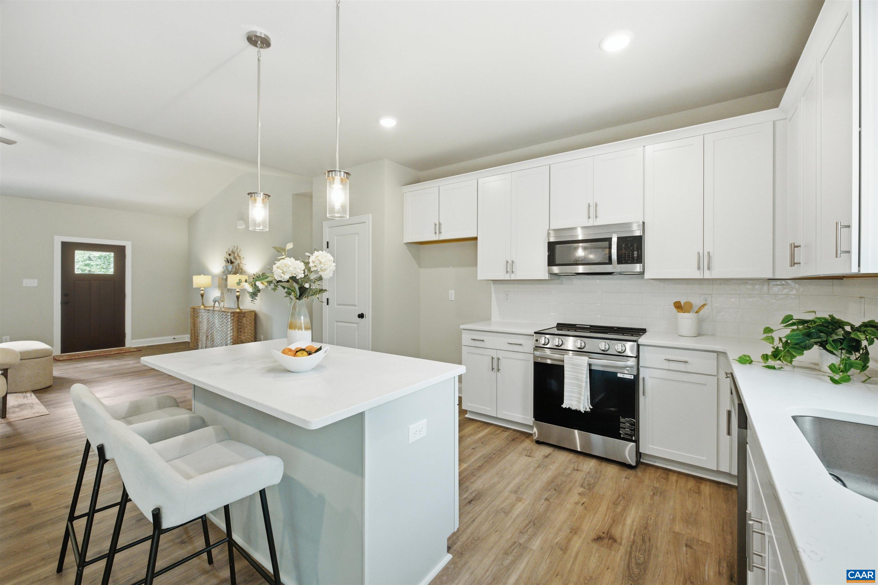 View to entry. Photo of for-sale home, staged.