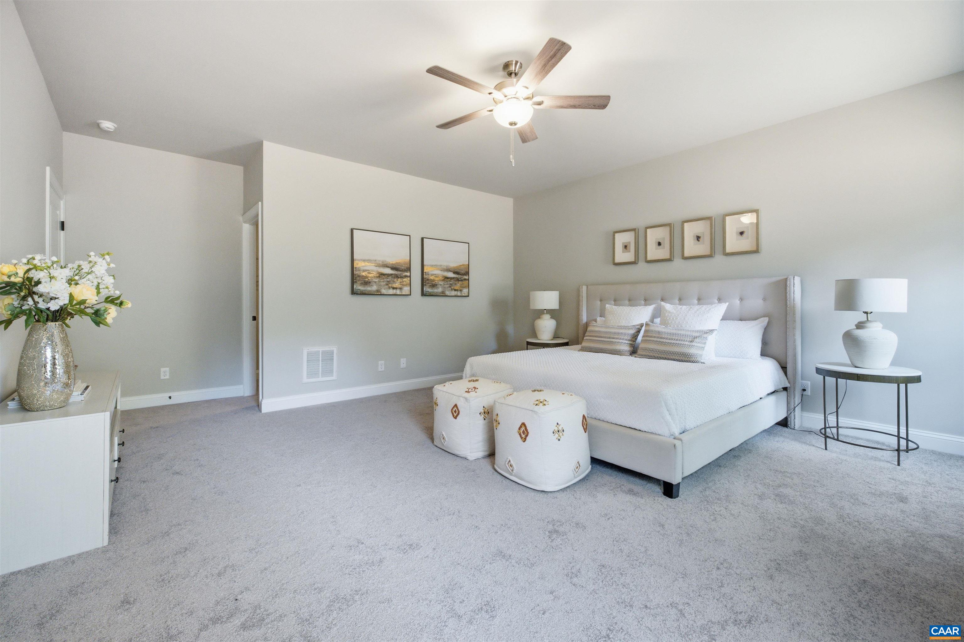Large, light and bright room. Walk-in closet access from the bedroom. Photo of for-sale home, staged.