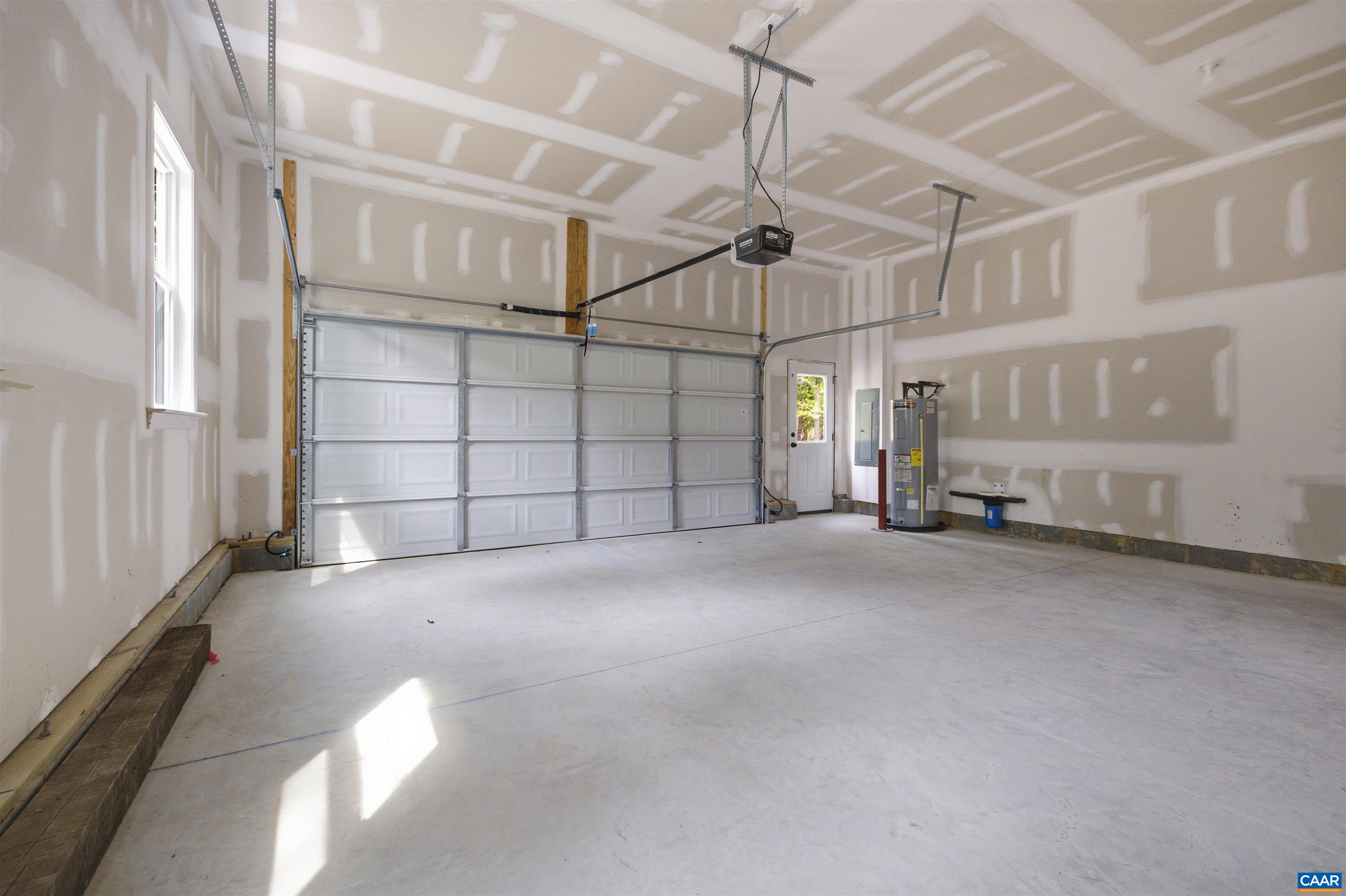 Located off the mudroom. Includes pedestrian door. Photo of the for-sale home.