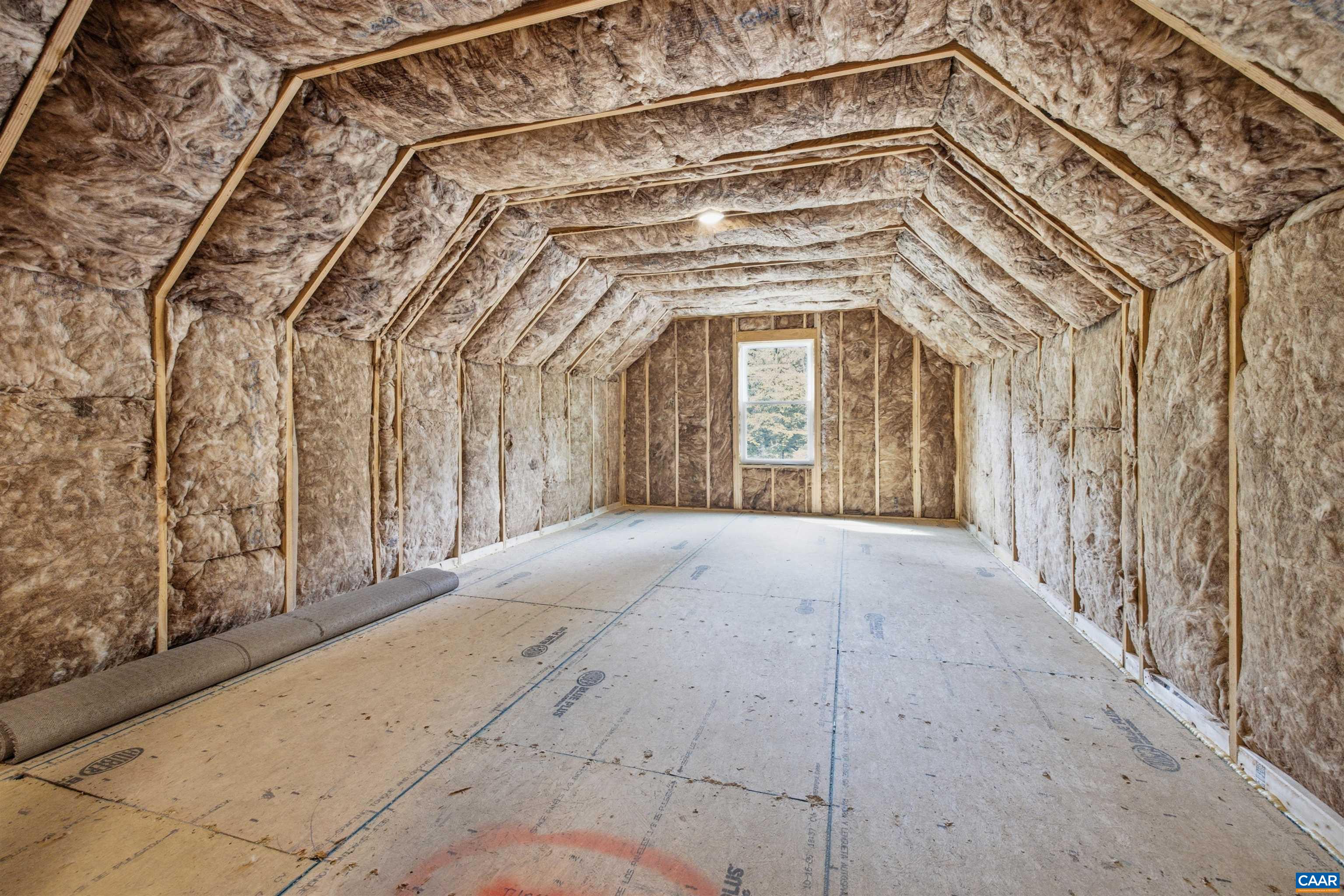 2nd floor space ready to finish or use as storage. Photo of the for-sale home.
