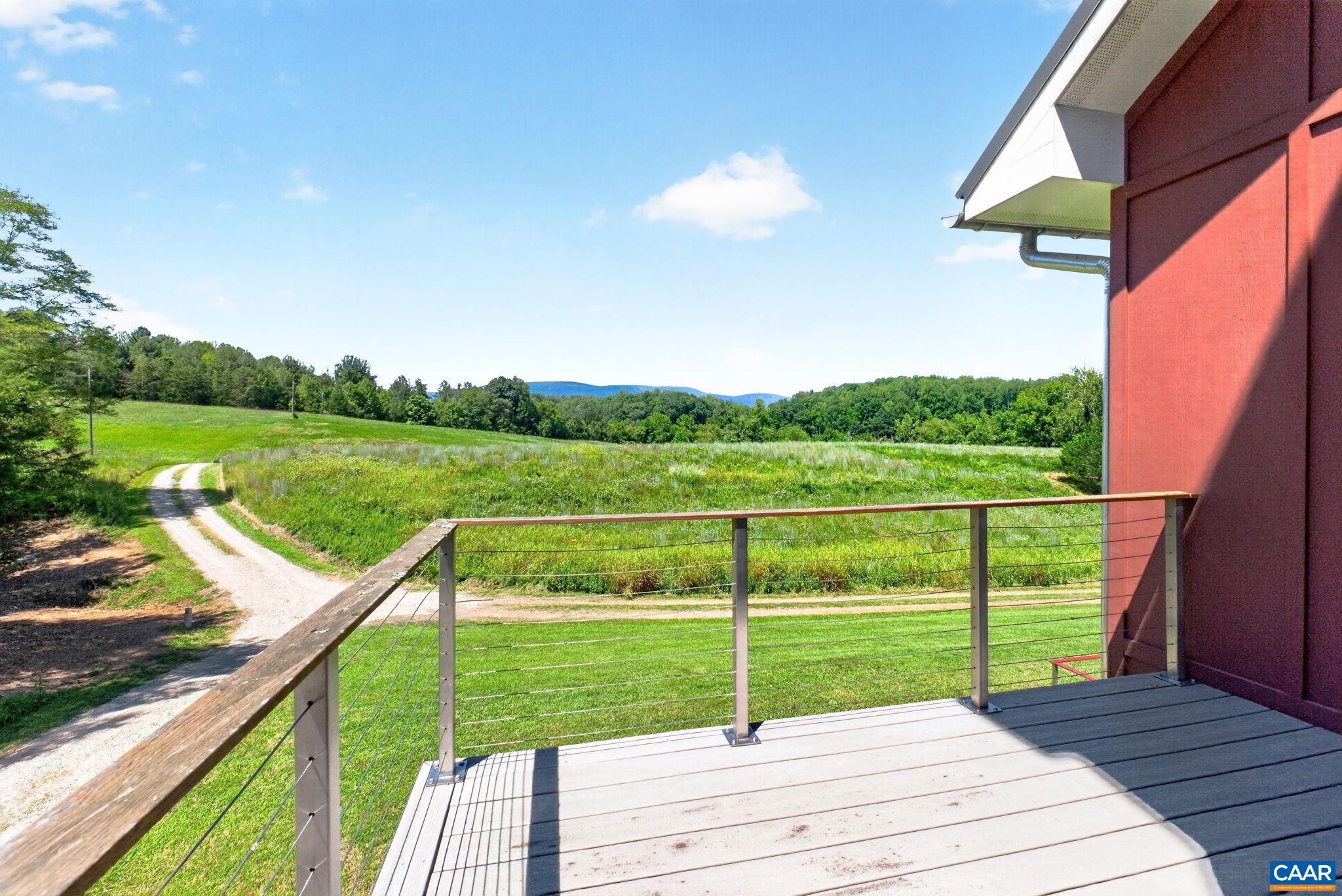 Upper level deck with field and mountain views. Upper level deck with field and mountain views.