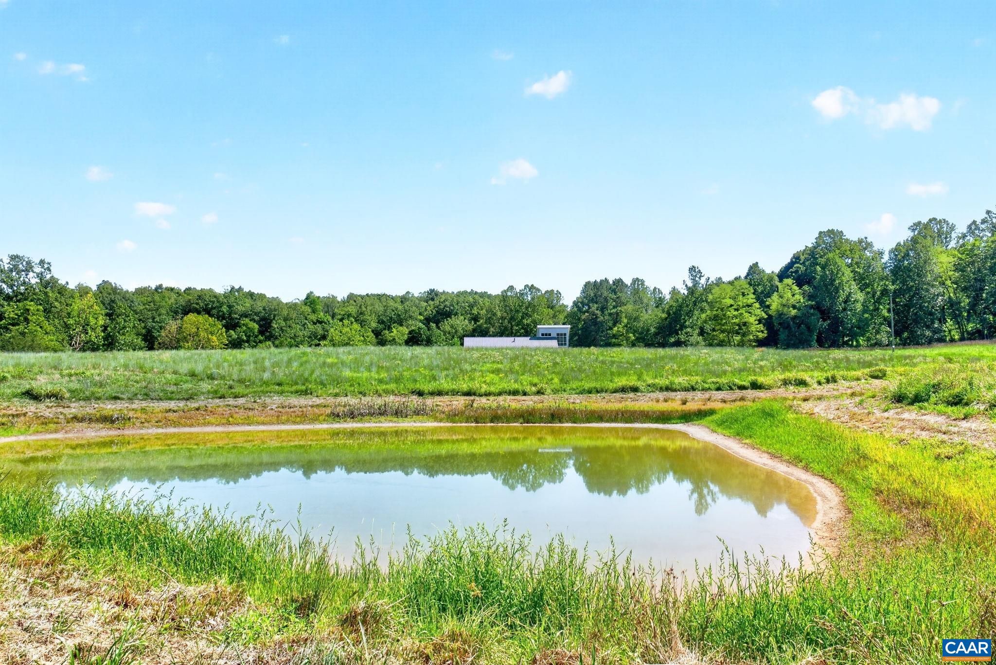 Looking over the pond towards the home. Looking over the pond towards the home.