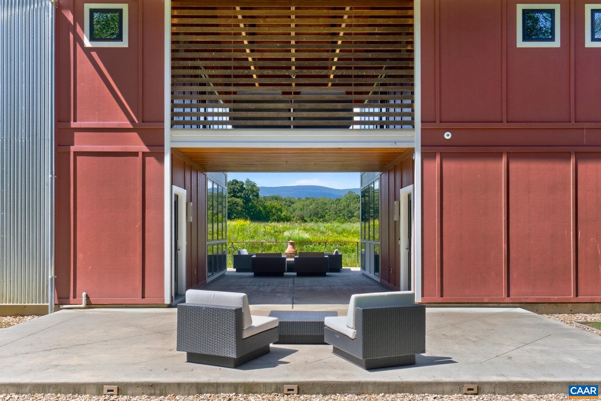 Front and rear patios with a covered breezeway connecting to Front and rear patios with a covered breezeway connecting to