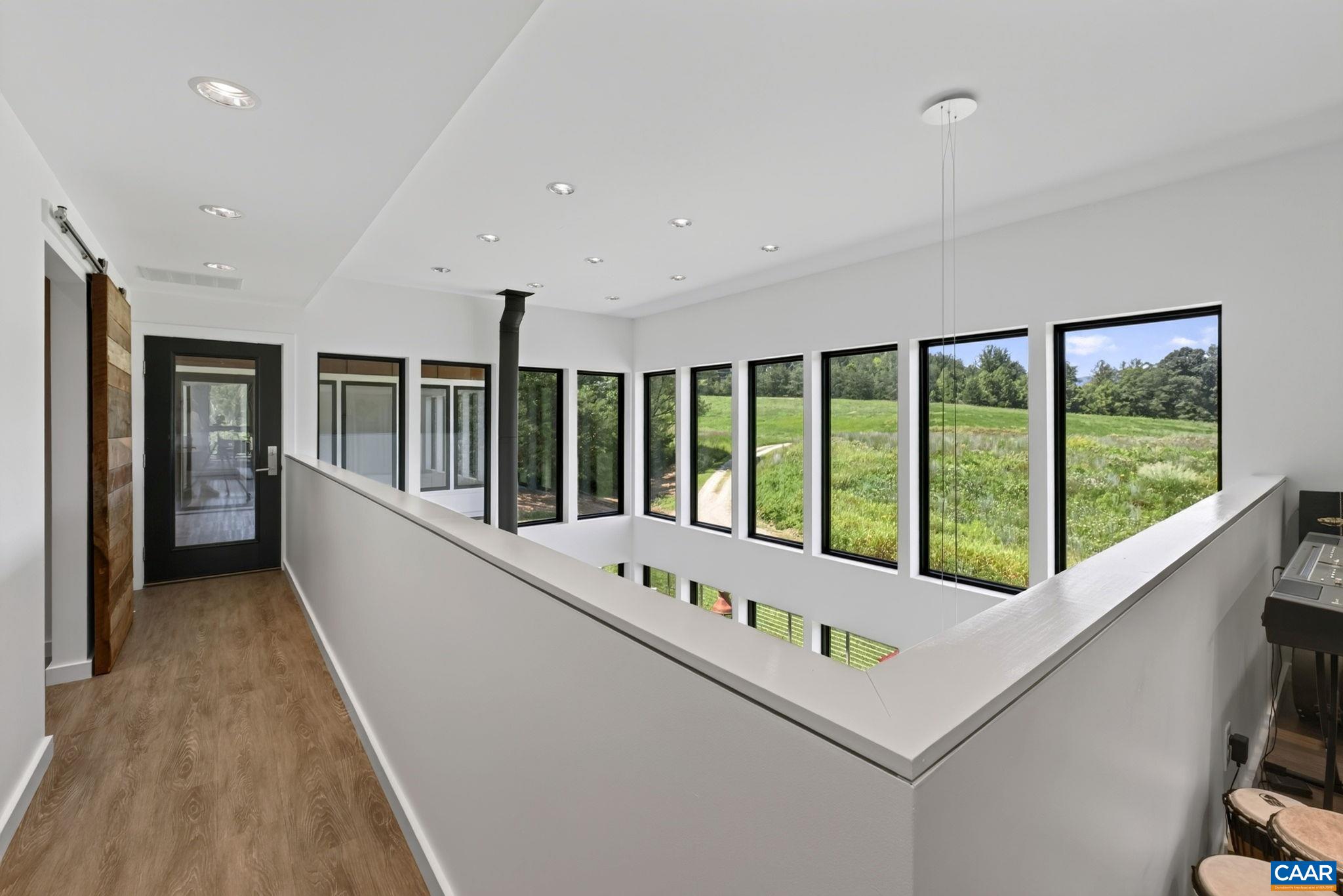 Walkway overlooking the living room. Walkway overlooking the living room.