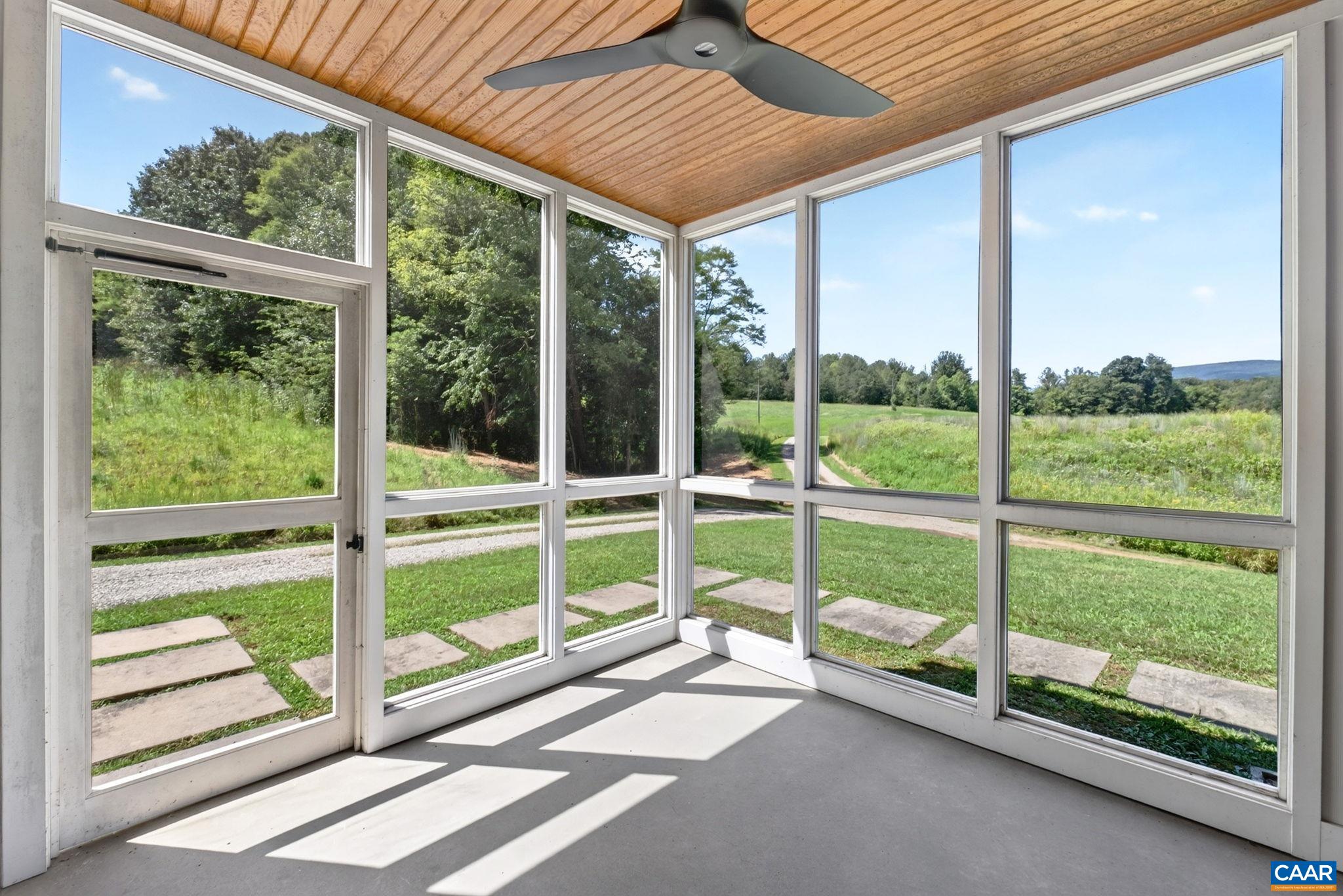 Screen porch with ceiling fan. Screen porch with ceiling fan.