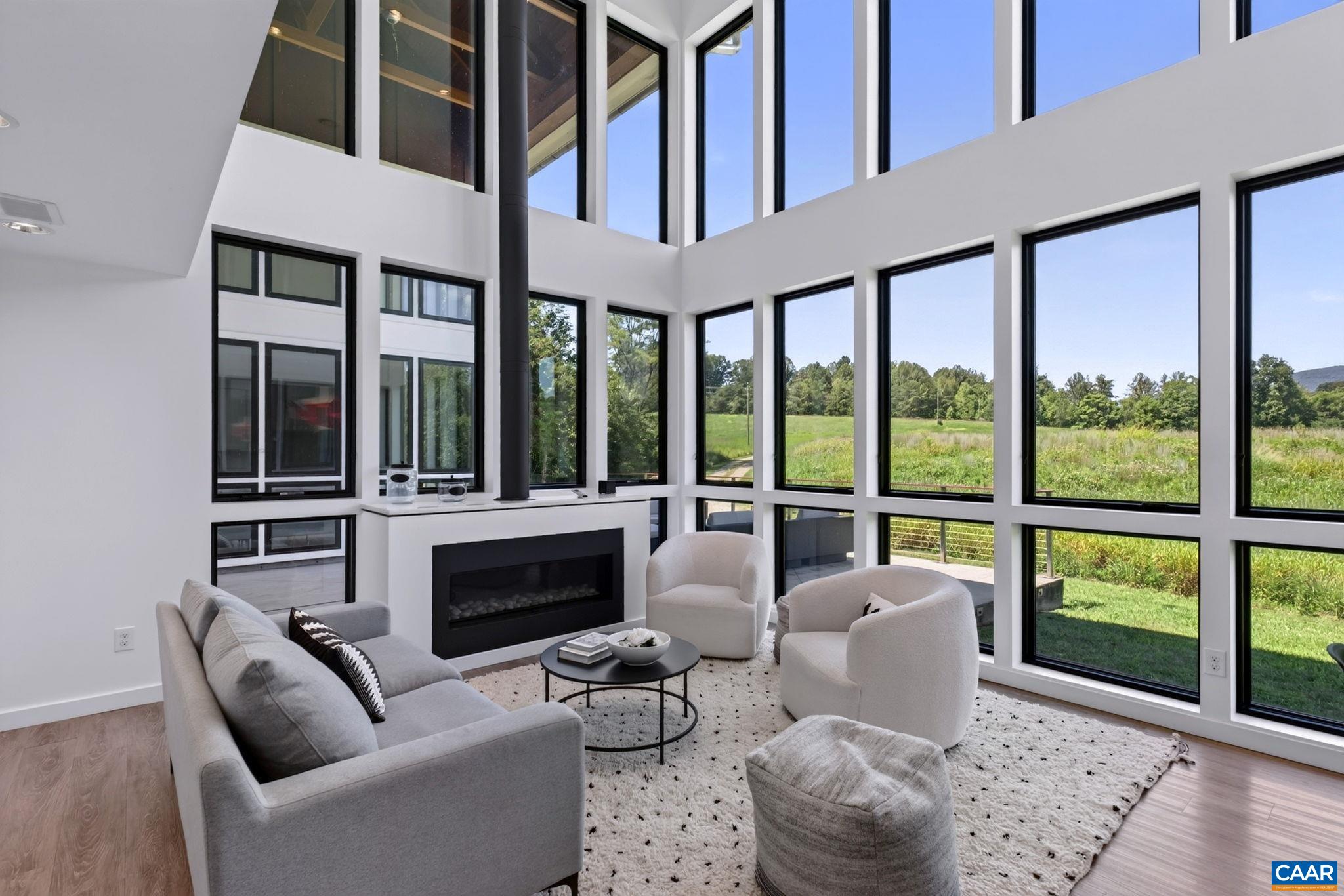 Two story living room with fireplace. Two story living room with fireplace.