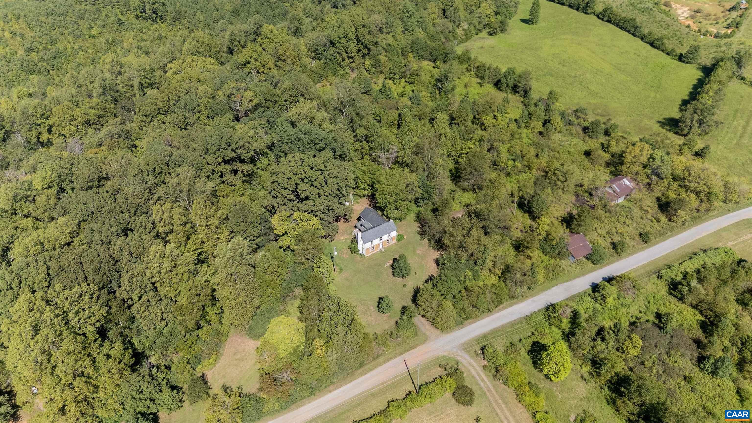 showing 1880's house and two barns.