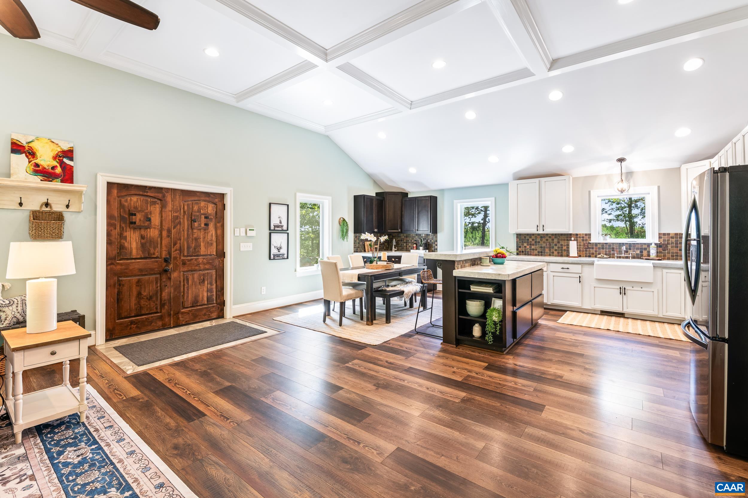 White cabinetry, concrete counters, large island White cabinetry, concrete counters, large island