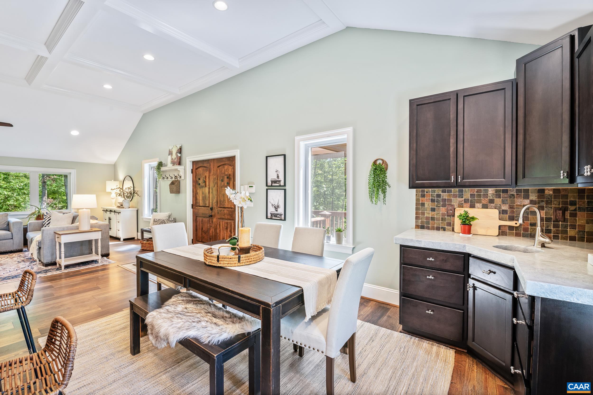 Dining area positioned between the kitchen and adjoining family room Dining area positioned between the kitchen and adjoining family room