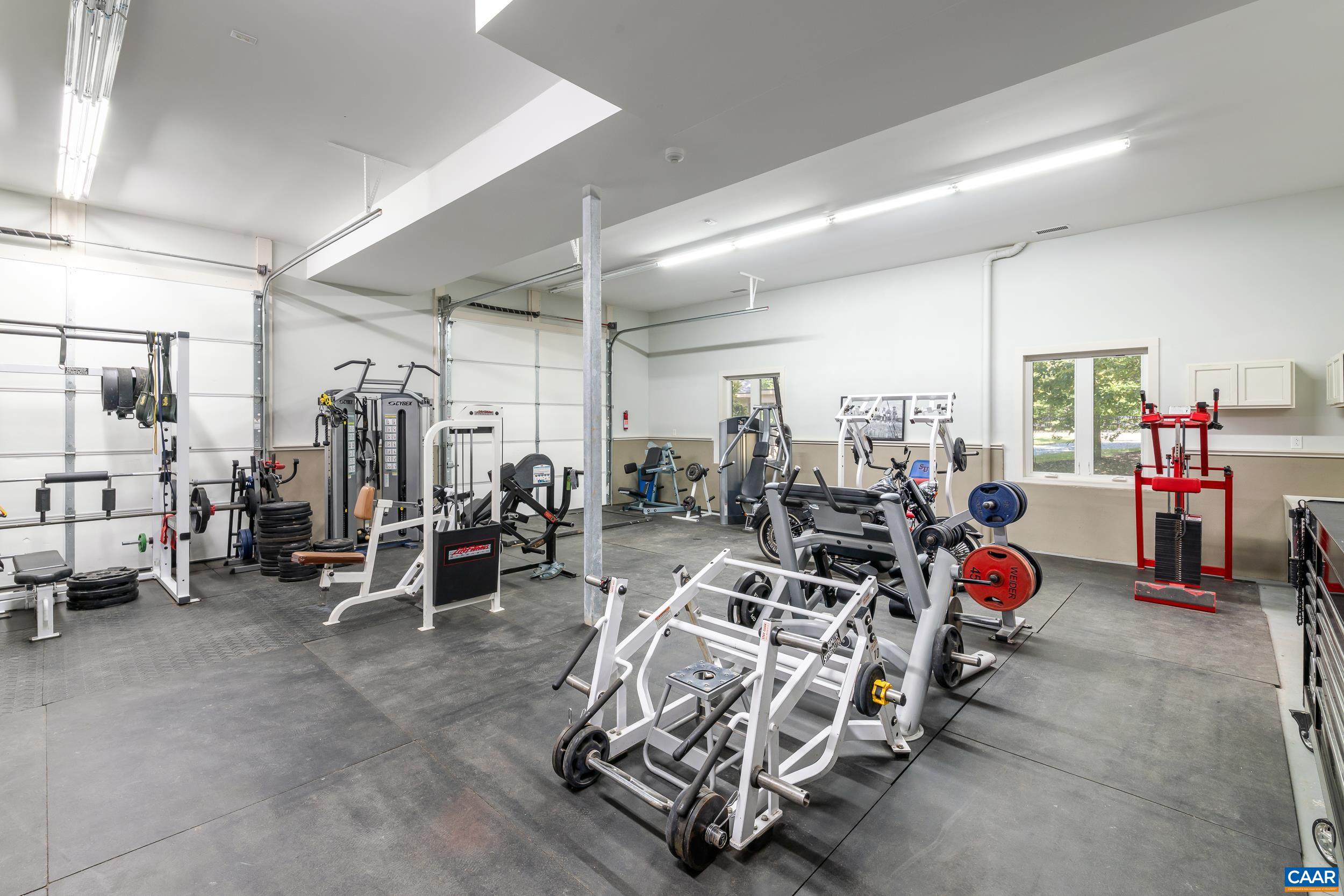 Spacious finished conditioned space currently utilized as a home gym Spacious finished conditioned space currently utilized as a home gym