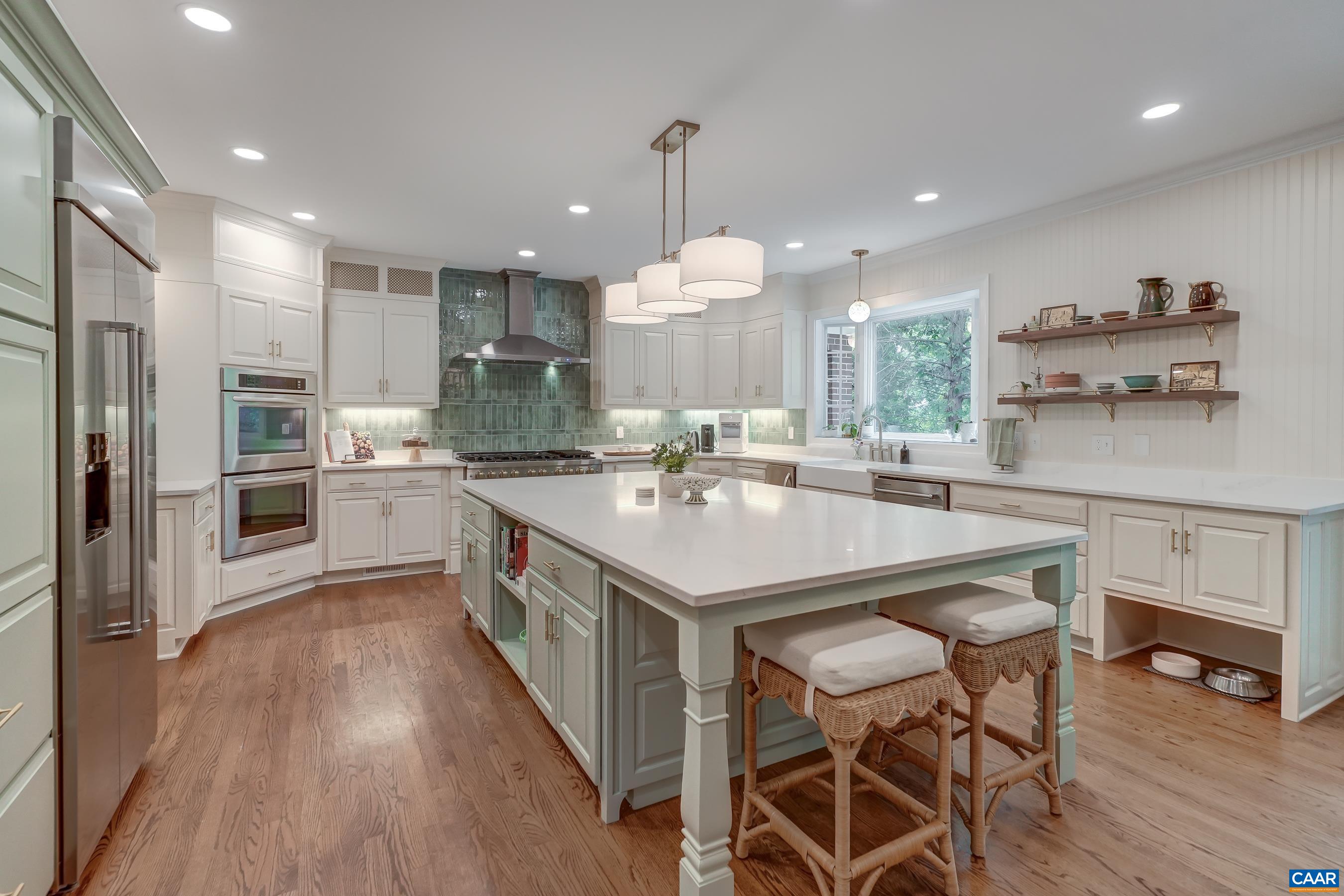 Fully renovated chef's kitchen with stunning quartz island. Fully renovated chef's kitchen with stunning quartz island.