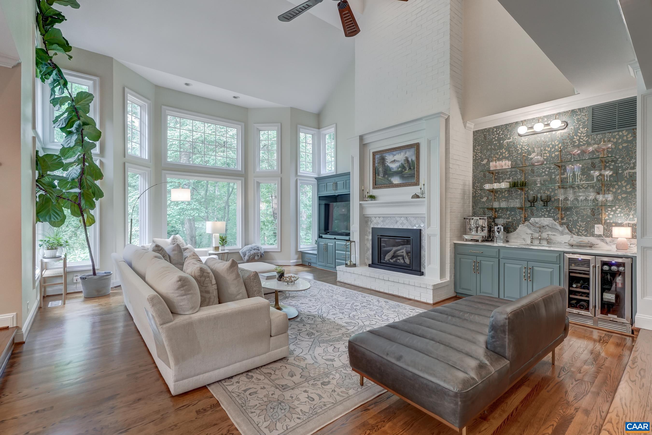 Dramatic great room with soarign vaulted cielign and wall of windows overlooking the beautiful back yard. Dramatic great room with soarign vaulted cielign and wall of windows overlooking the beautiful back yard.