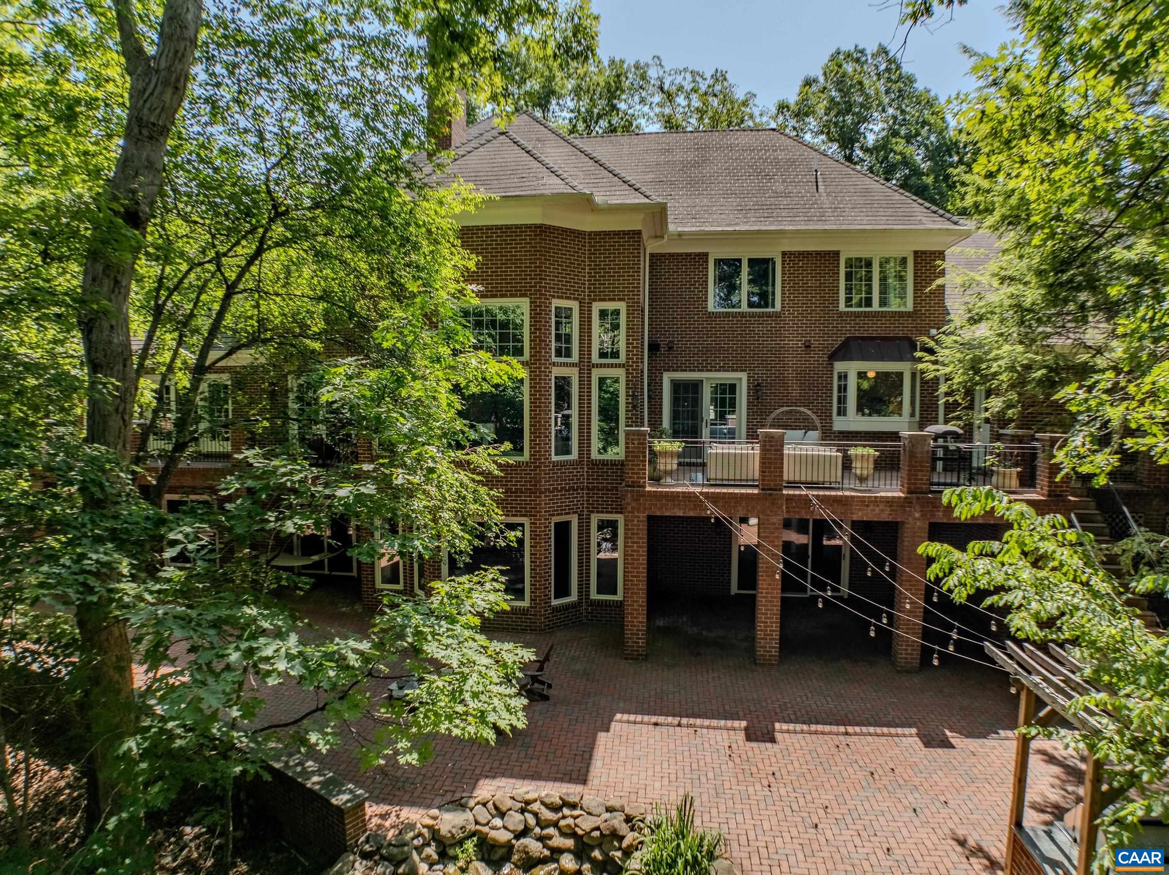 Exceptional outdoor entertaining spaces include custom brick patio with outdoor kitchen. Exceptional outdoor entertaining spaces include custom brick patio with outdoor kitchen.