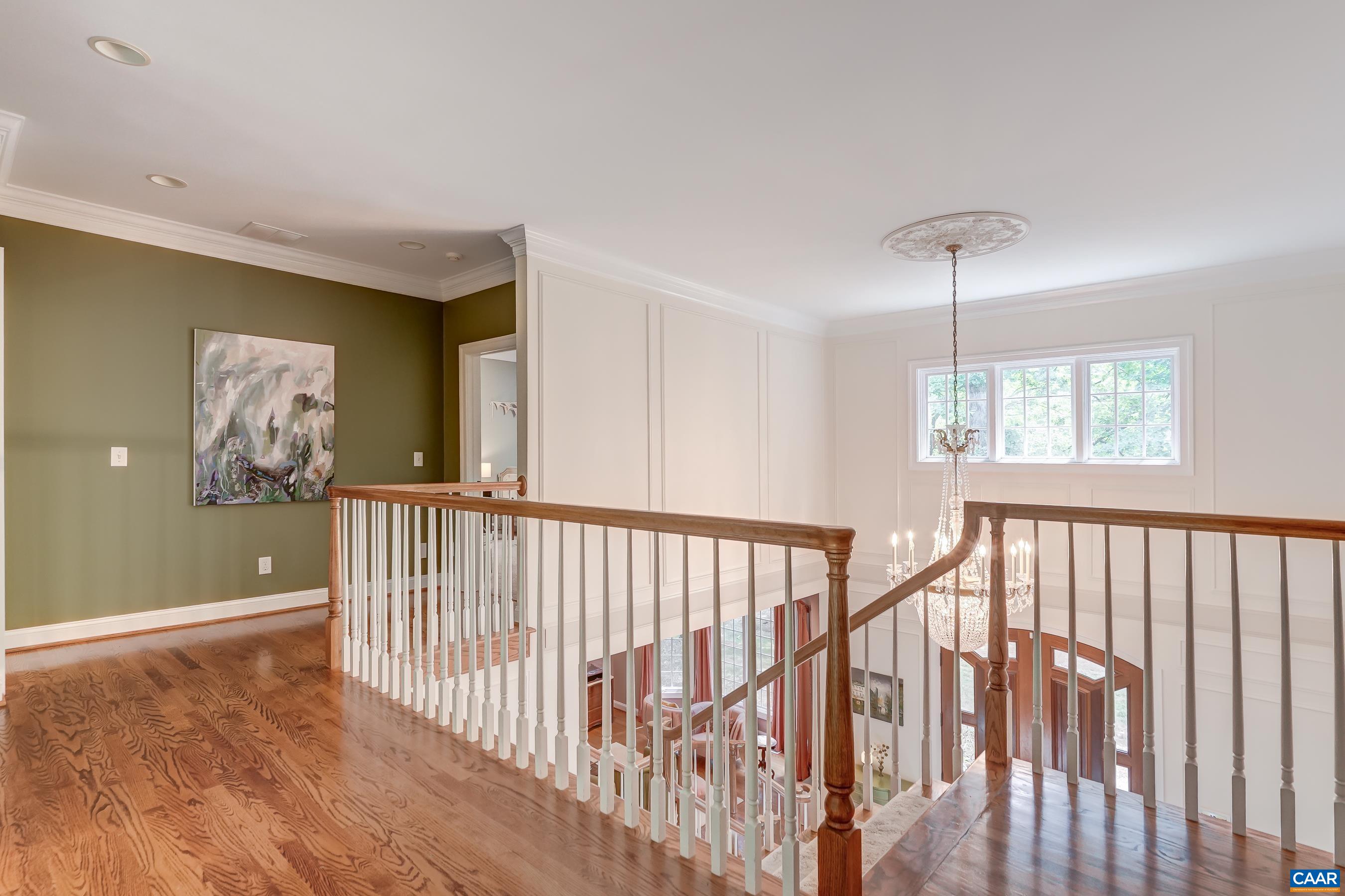 Second floor hallway with views to below. Second floor hallway with views to below.