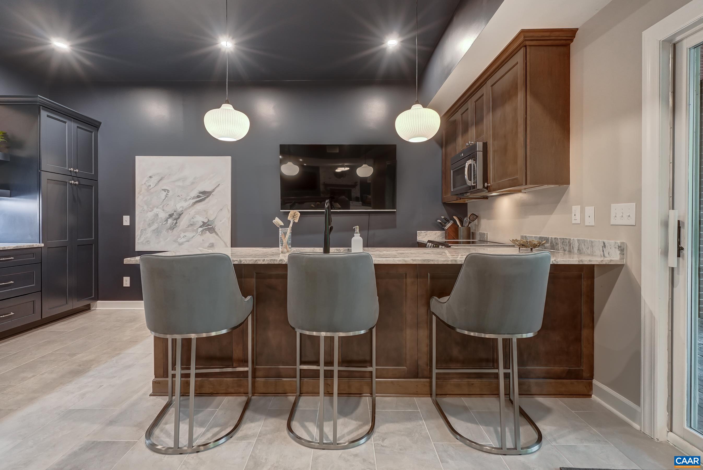Second kitchen with bar in basement. Second kitchen with bar in basement.