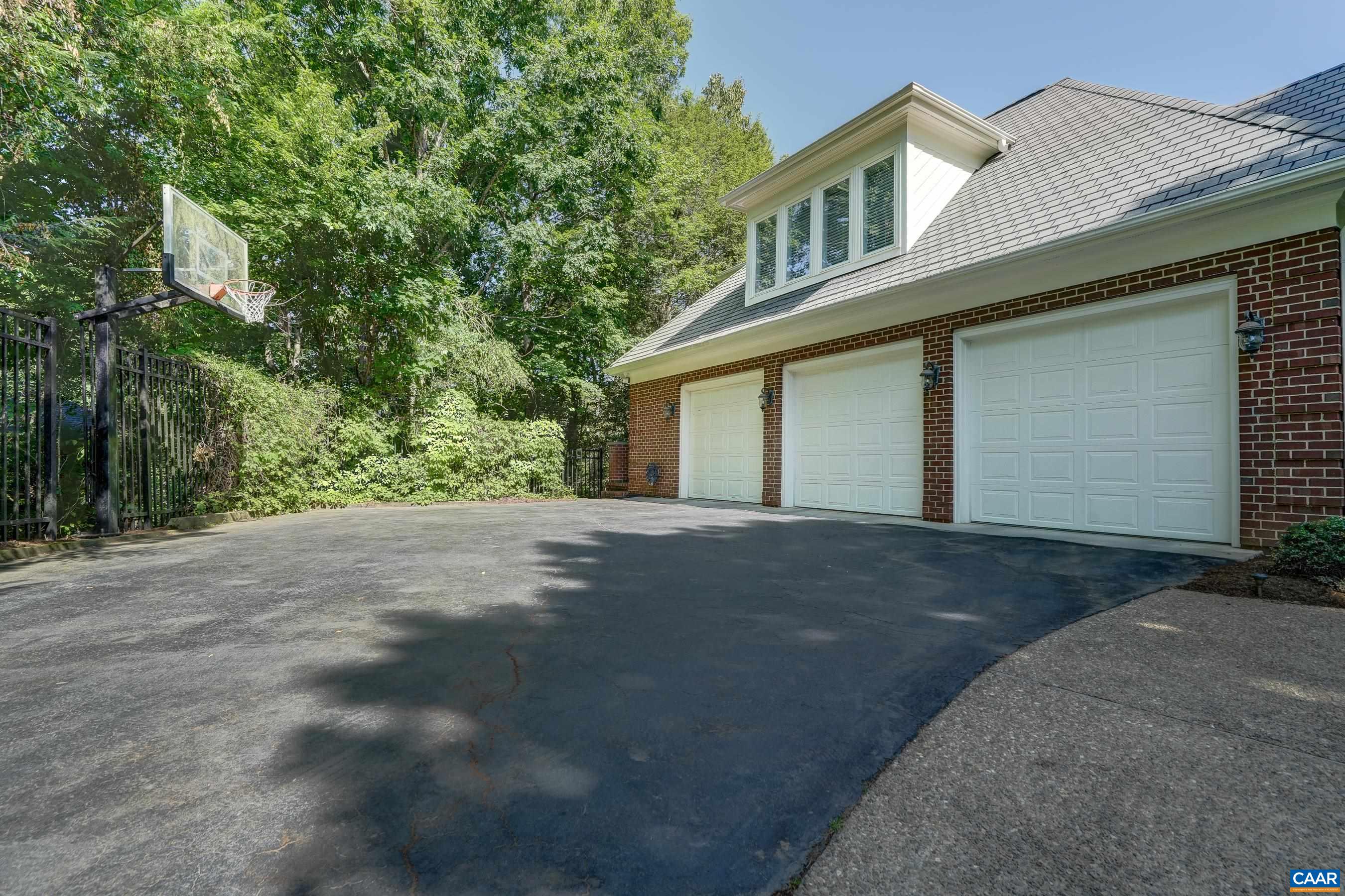 Three car garage with EV charger for Tesla Three car garage with EV charger for Tesla