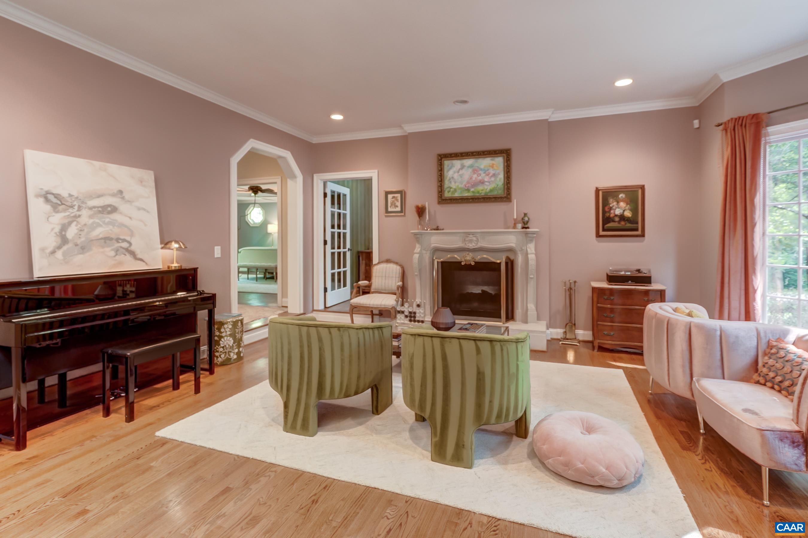 High end architectural details include custom mill work and deisgner wall coverings. Formal living room with gaas fireplace. High end architectural details include custom mill work and deisgner wall coverings. Formal living room with gaas fireplace.