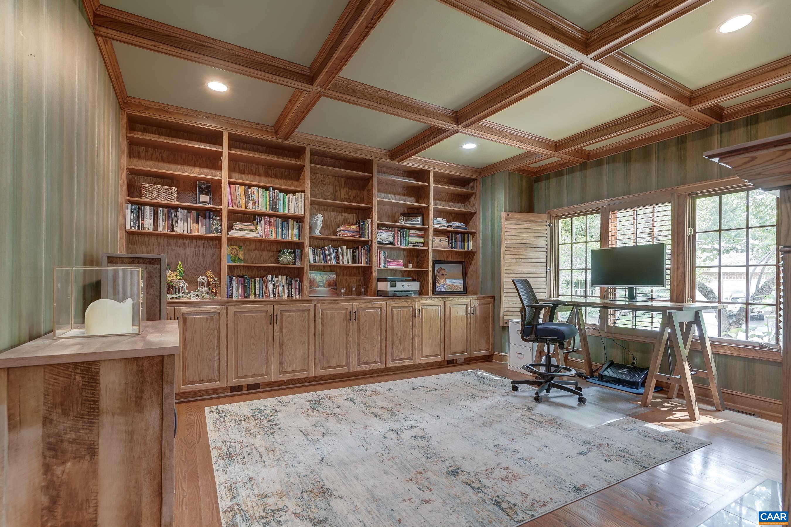 Home office features built-in bookshelves and coffered ceiling. Home office features built-in bookshelves and coffered ceiling.