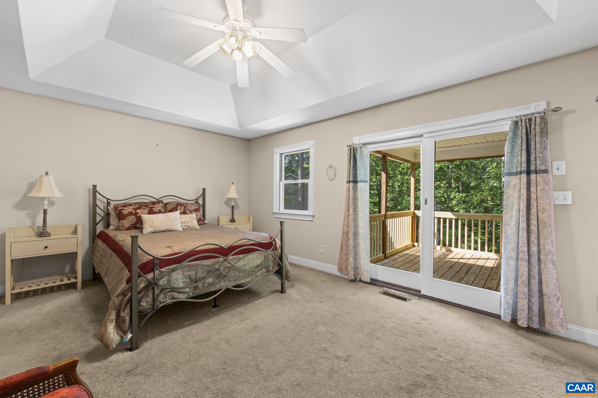 The 1st floor primary suite offers both comfort and convenience with a spacious walk-in-closet, private bath, vaulted ceilings and direct access to the rear covered deck. A peaceful retreat with easy one level living.