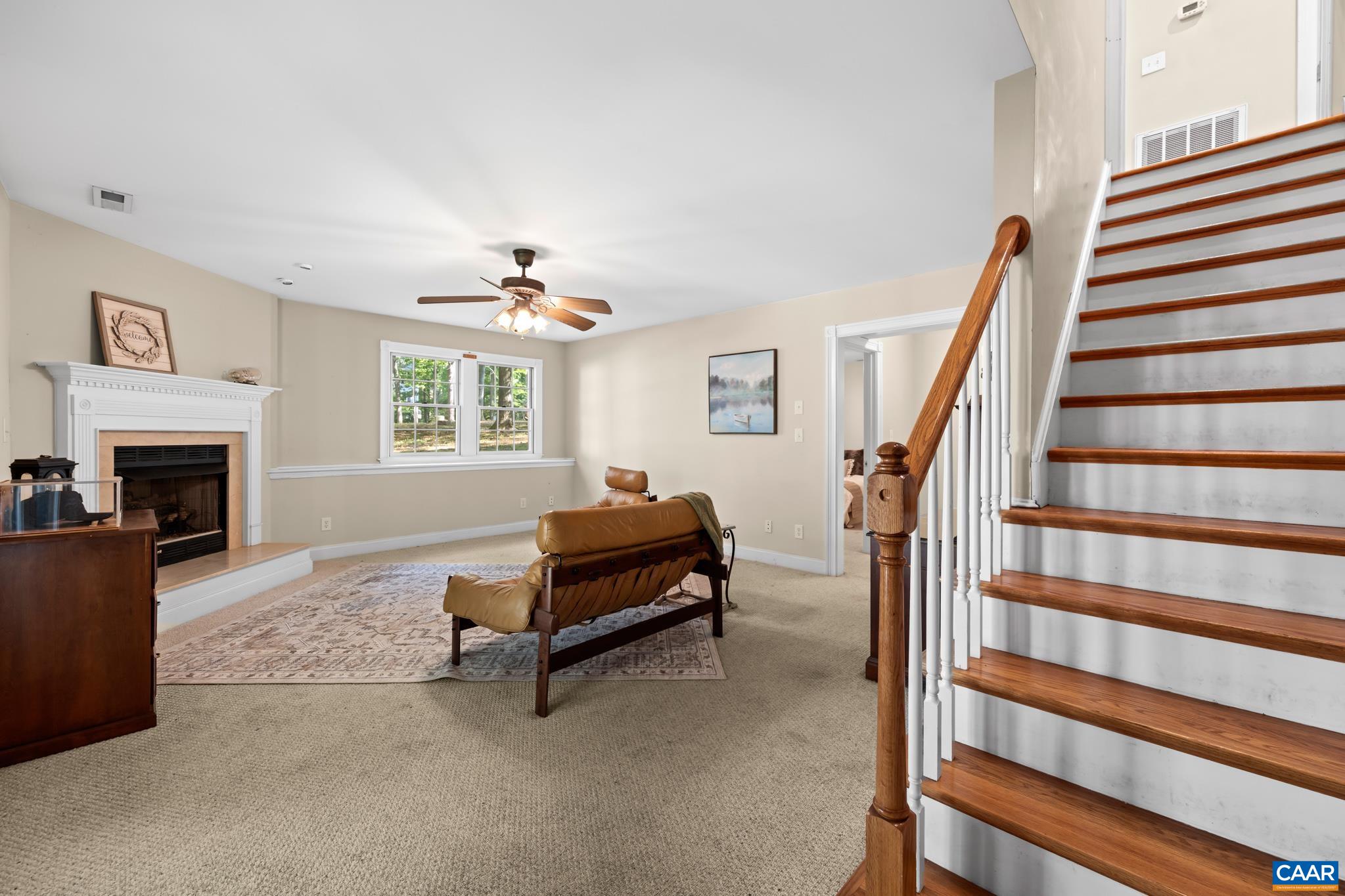 Spacious finished terrace level basement with a family room/den. Features a cozy fireplace and direct patio and backyard access.