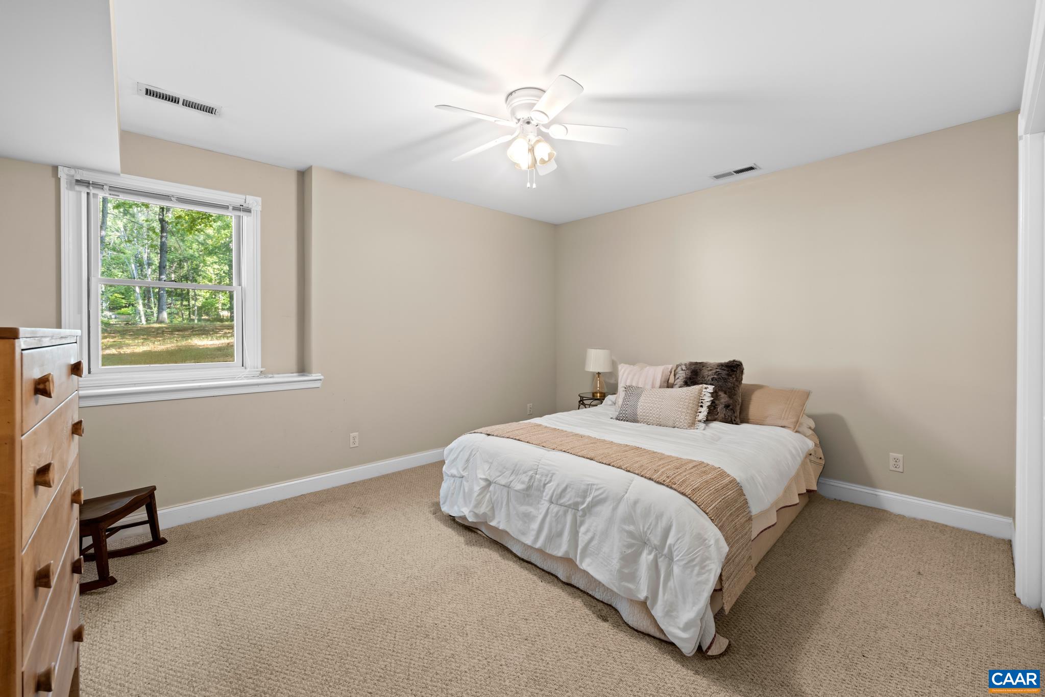 The bright and sunny 4th bedroom located in the basement, offers a comfortable retreat for guests or an ideal in-law suite. Conveniently connected to the family room, access to a full bathroom and laundry. Direct outdoor access for added privacy.